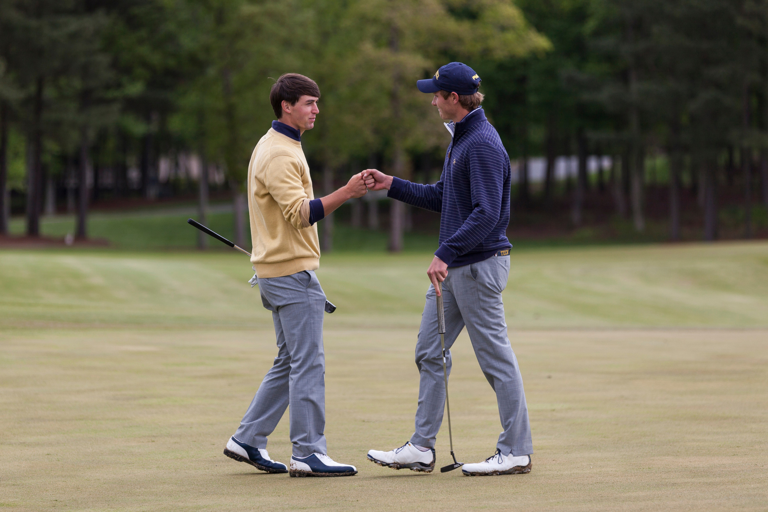 Ollie Schniederjans and Vincent Whaley congratulate each other following the playoff of the ACC Golf Championship, April 26, 2015, Old North State Club, New London, N.C.
