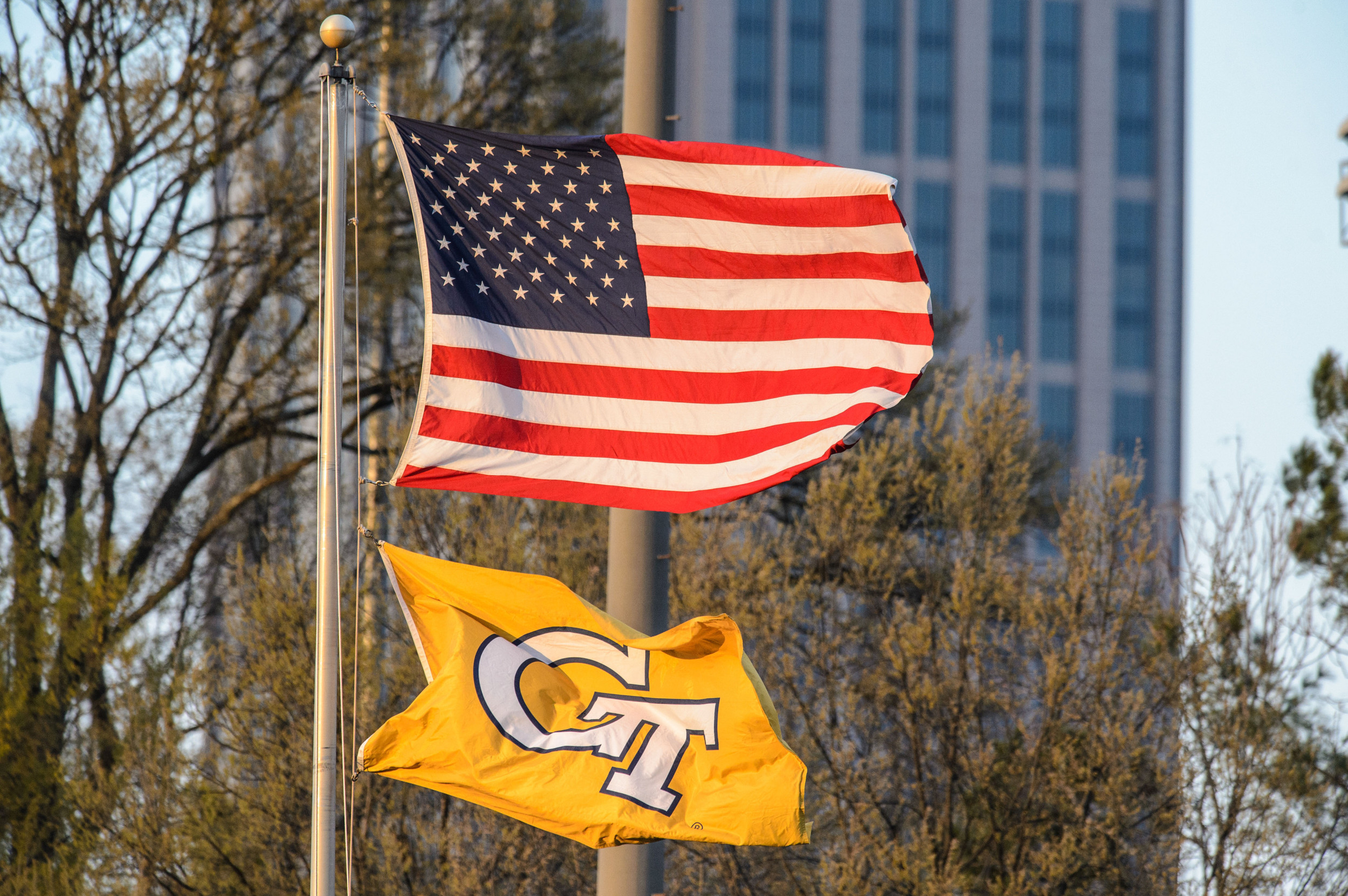 The American flag and GT flag wave on a windy day at the Rusty C.