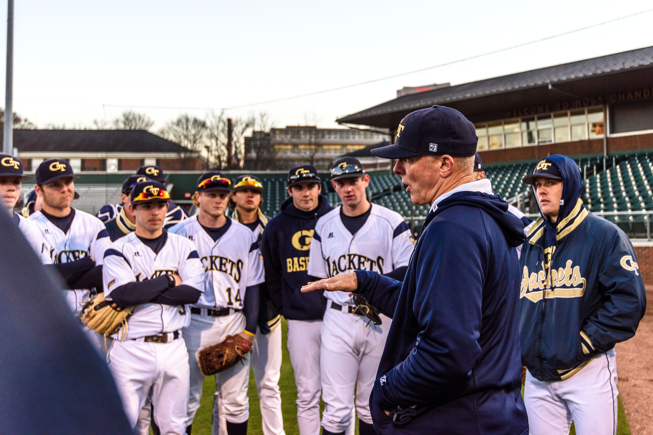 Coach Danny Hall (17) talks with the team after the game