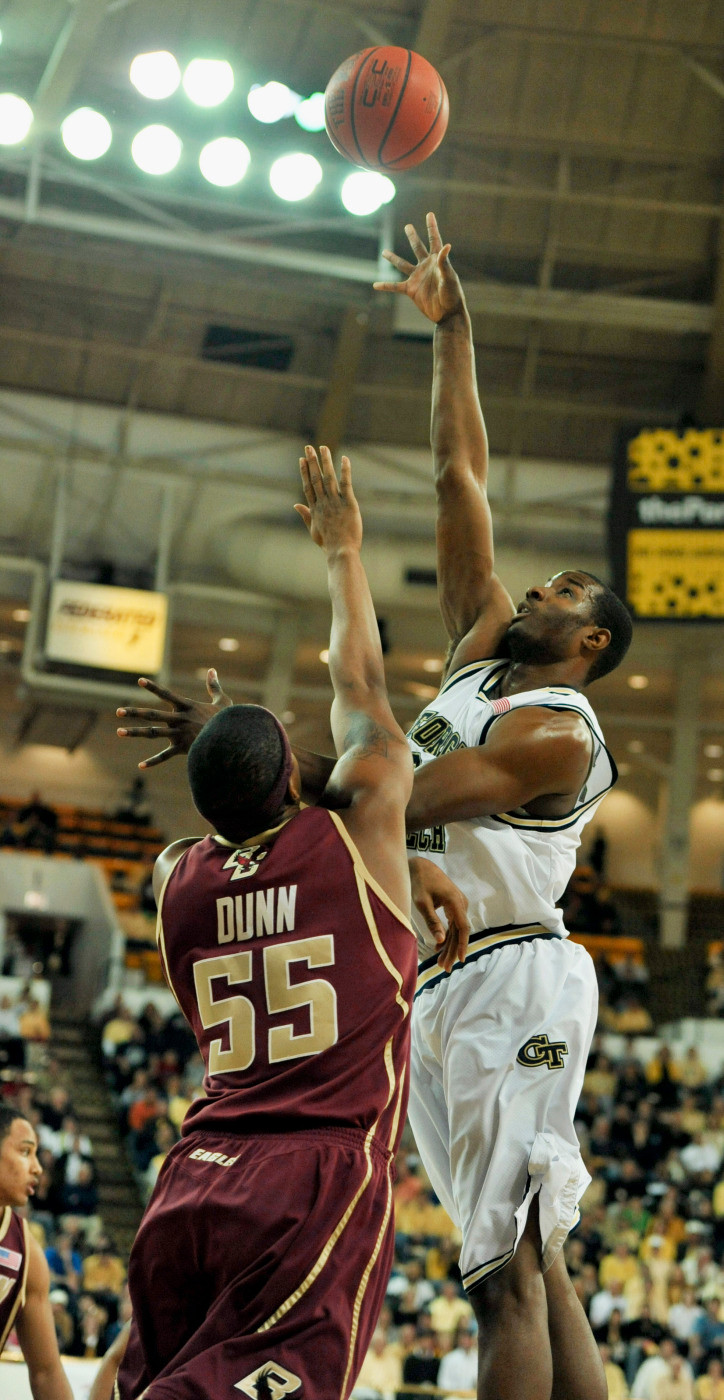 Georgia Tech forward Gani Lawal, right, takes a shot against Boston College forward Cortney Dunn (55) during the first half of an NCAA college basketball game at the Alexander Memorial Coliseum, Saturday, Feb. 27, 2010 in Atlanta. (AP Photo/Gregory Smith)