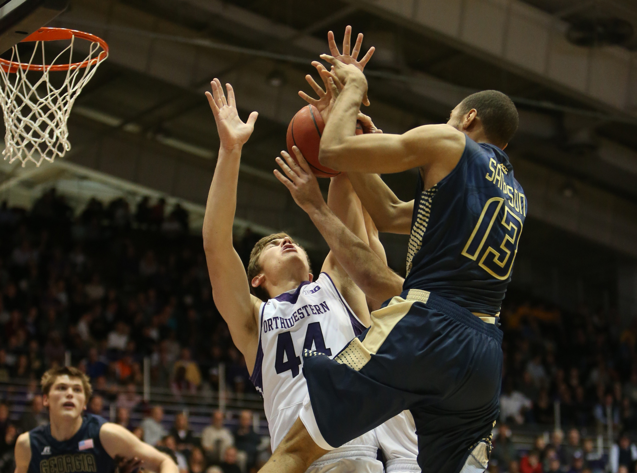 Northwestern Wildcats forward Gavin Skelly (44) fouls Georgia Tech Yellow Jackets forward Robert Sampson (13) as he goes up for a shot during the game at Welsh-Ryan Arena. Mandatory Credit: Caylor Arnold-USA TODAY Sports