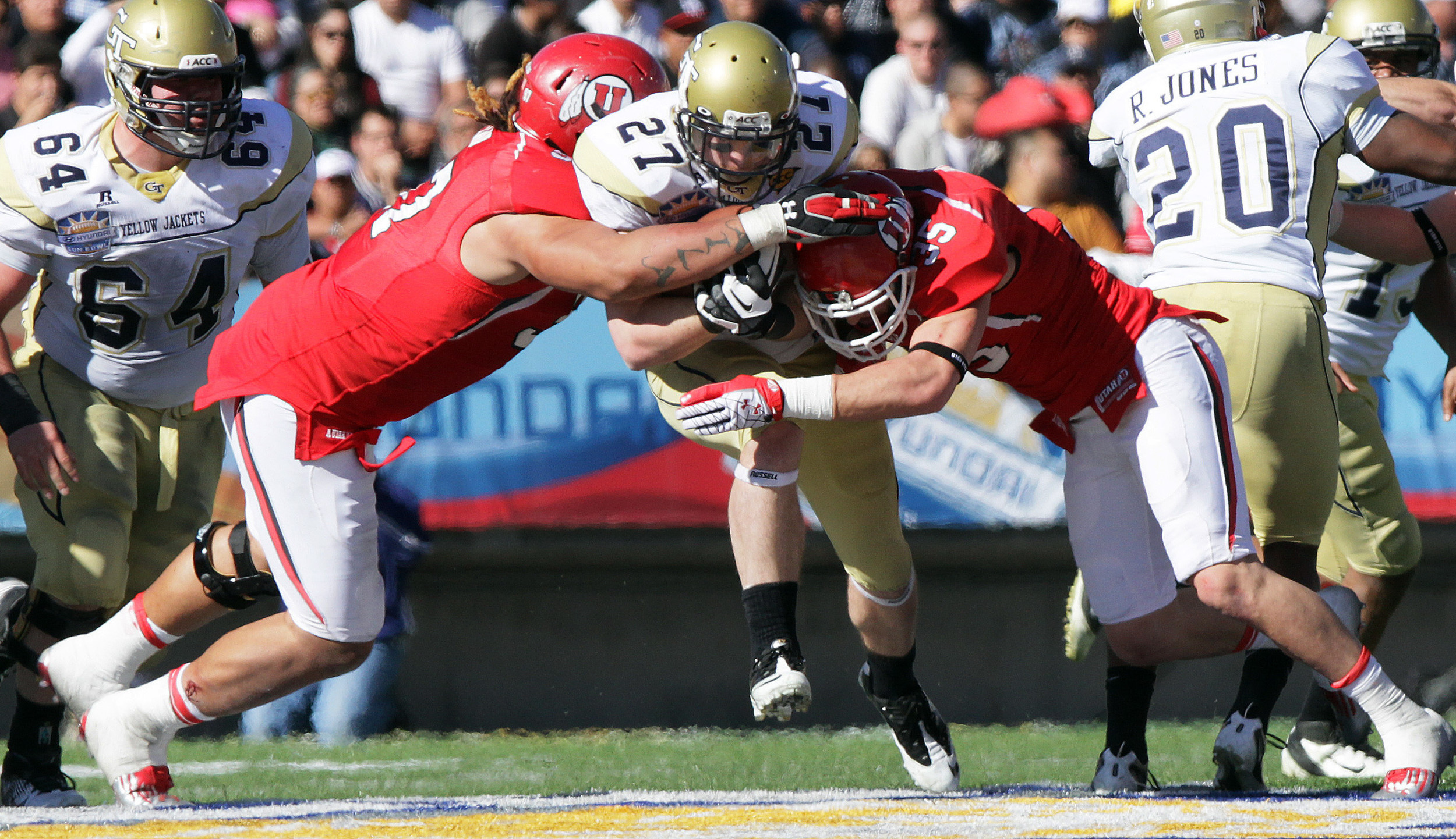Georgia Tech running back Preston Lyons drives between Utah defense during the Sun Bowl NCAA college football game on Saturday, Dec. 31, 2011, in El Paso, Texas. Utah won 30-27 in overtime. (AP Photo/El Paso Times, Mark Lambie) EL DIARIO OUT; JUAREZ MEXICO OUT; IF USE ON LAM OR LAT AND EL DIARIO DE EL PASO OUT