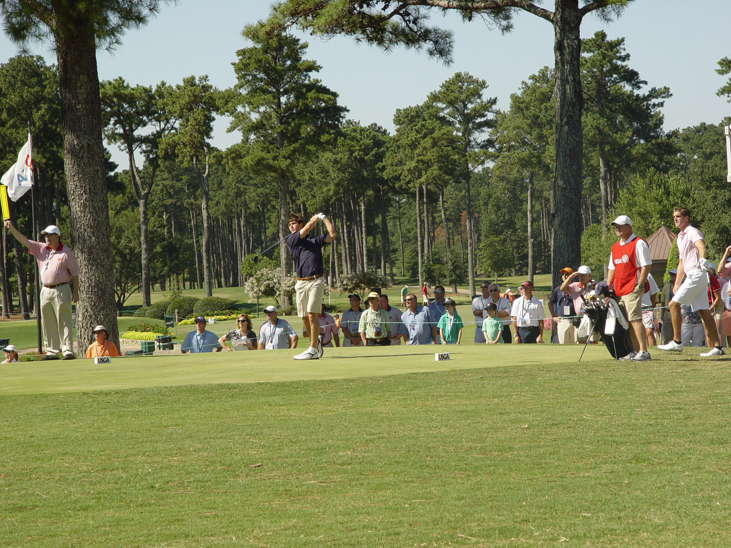 Ollie Schniederjans hits his tee shot at the 1st hole of his opening round of match play at the U.S. Amateur, Highlands Course, Atlanta Athletic Club, August 14, 2014