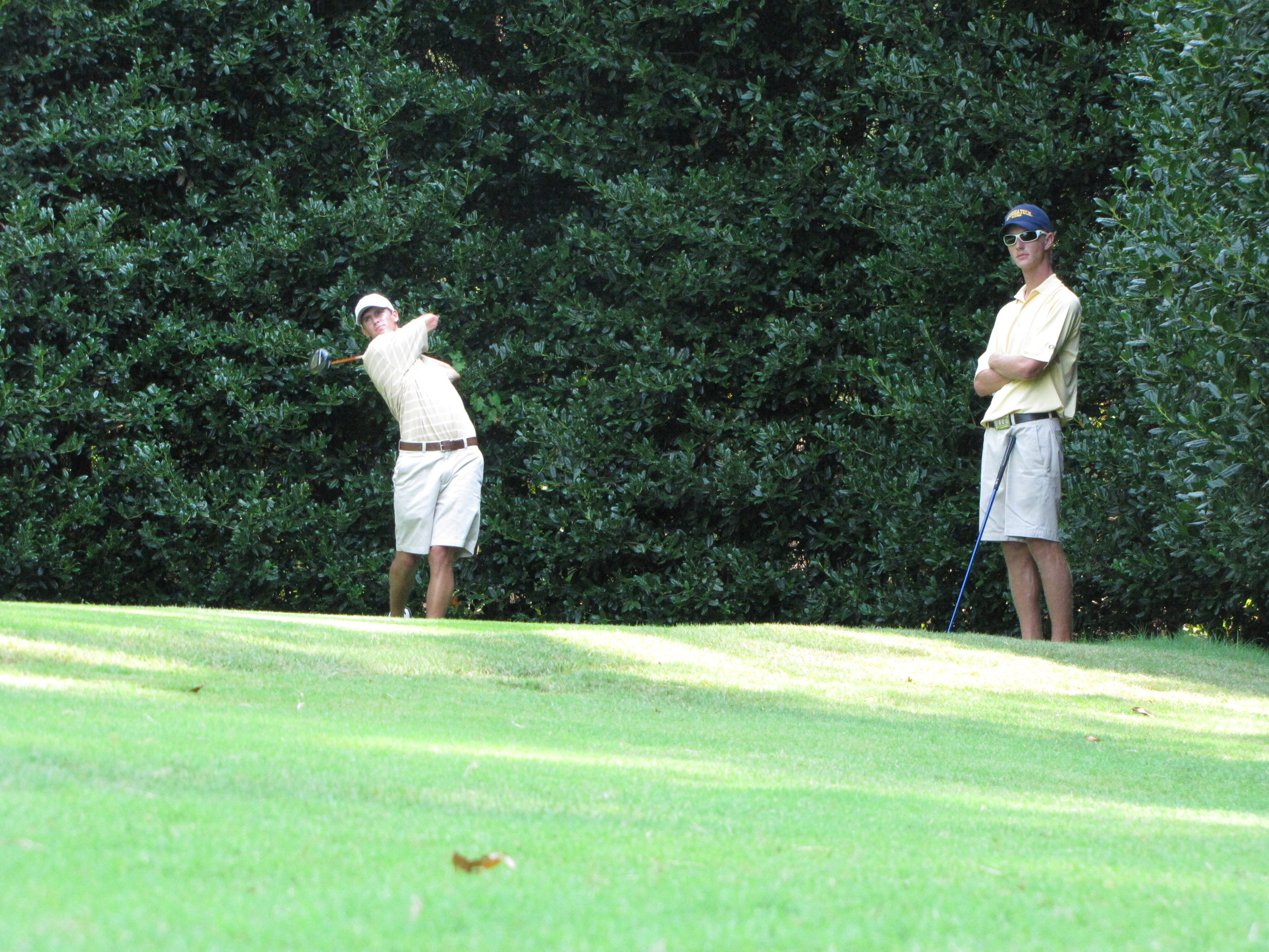 James White hits while Drew Czuchry watches during Georgia Tech's preseason qualifying, September 3 at the Golf Club of Georgia.