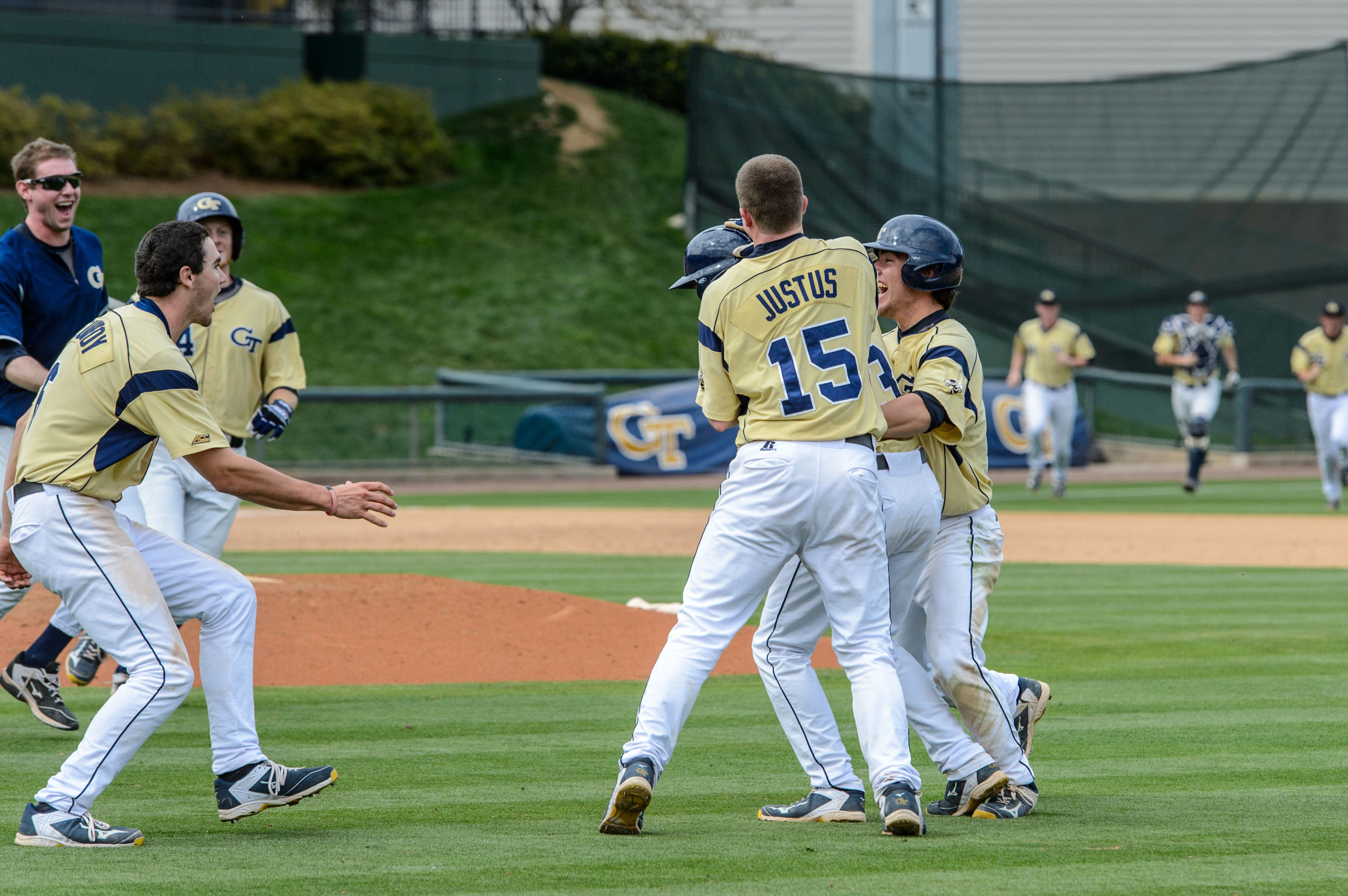 Thomas Smith is swarmed by the team after his walk-off single