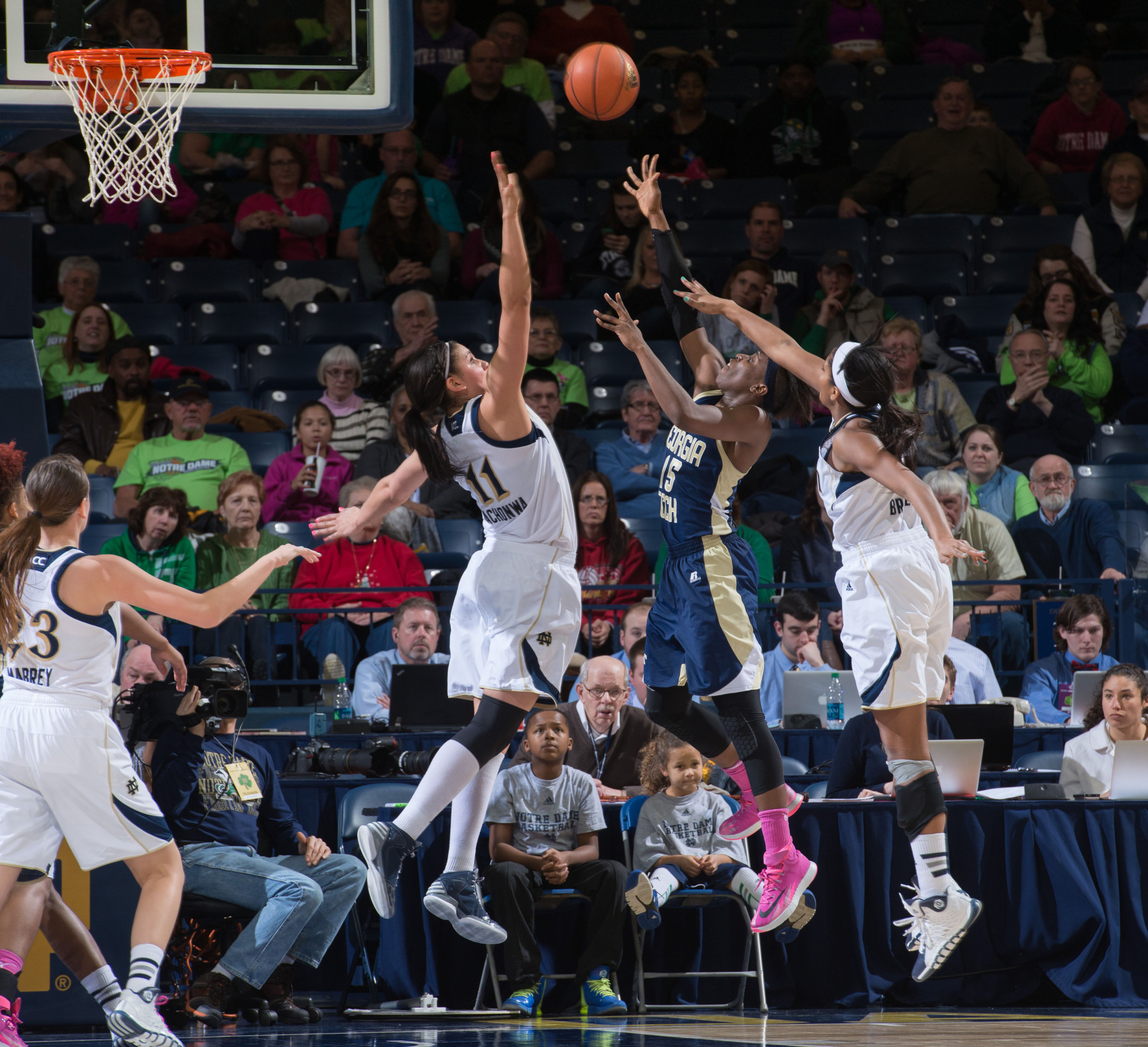 Feb 17, 2014; South Bend, IN, USA; Georgia Tech Yellow Jackets guard Tyaunna Marshall (15) shoots the ball as Notre Dame Fighting Irish forward Natalie Achonwa (11) guard Ariel Braker (44) defends in the second half at the Purcell Pavilion. Mandatory Credit: Matt Cashore-USA TODAY Sports