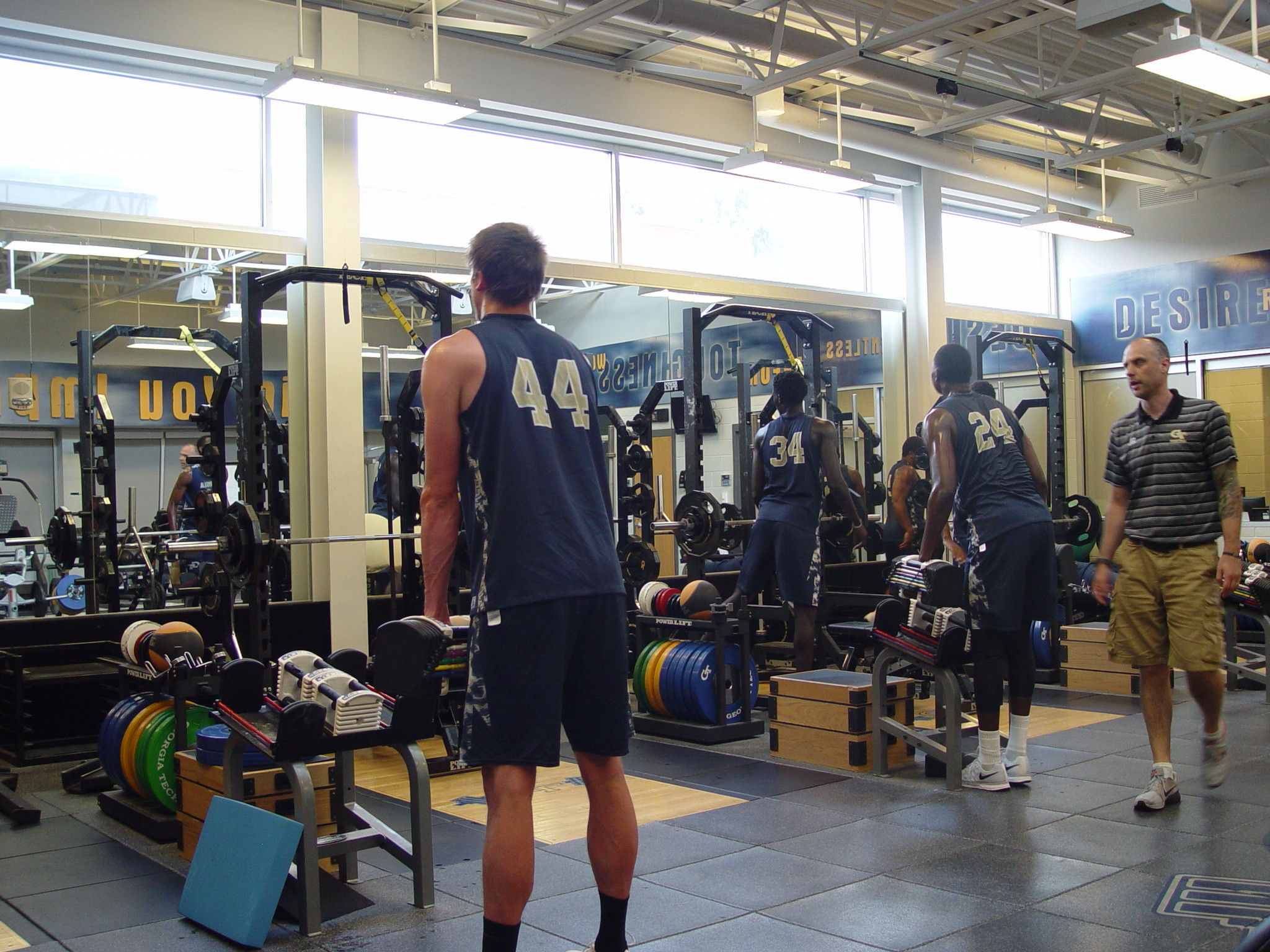 Player development coach Dan Taylor takes the Georgia Tech men's basketball team through a workout on June 16, 2016 in the Zelnak Center weight room.