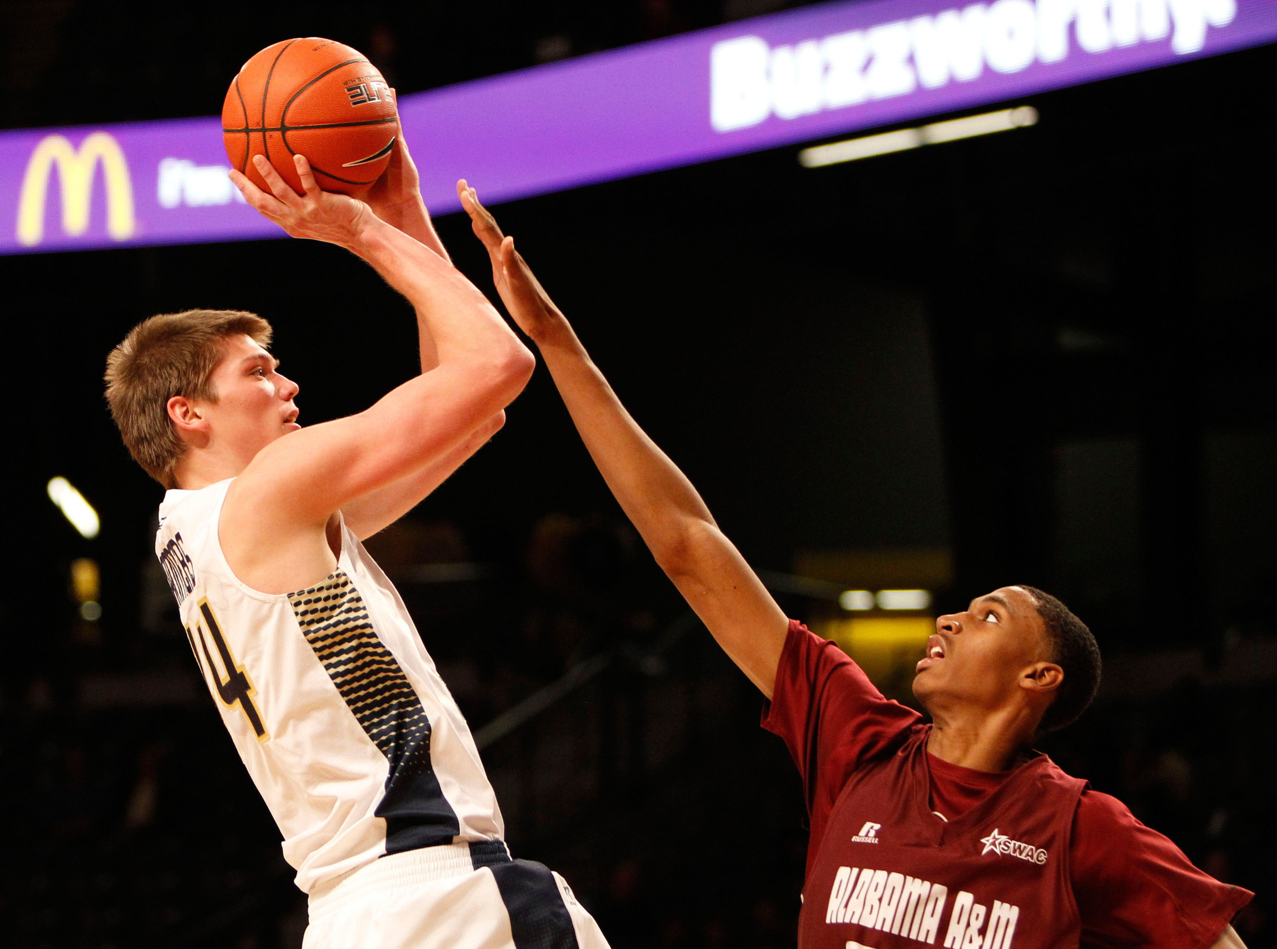 Nov 18, 2014; Atlanta, GA, USA; Yellow Jackets center Ben Lammers (44) shoots the ball over Alabama A&M Bulldogs forward Nicholas West (35) in the second half. Brett Davis-USA TODAY Sports