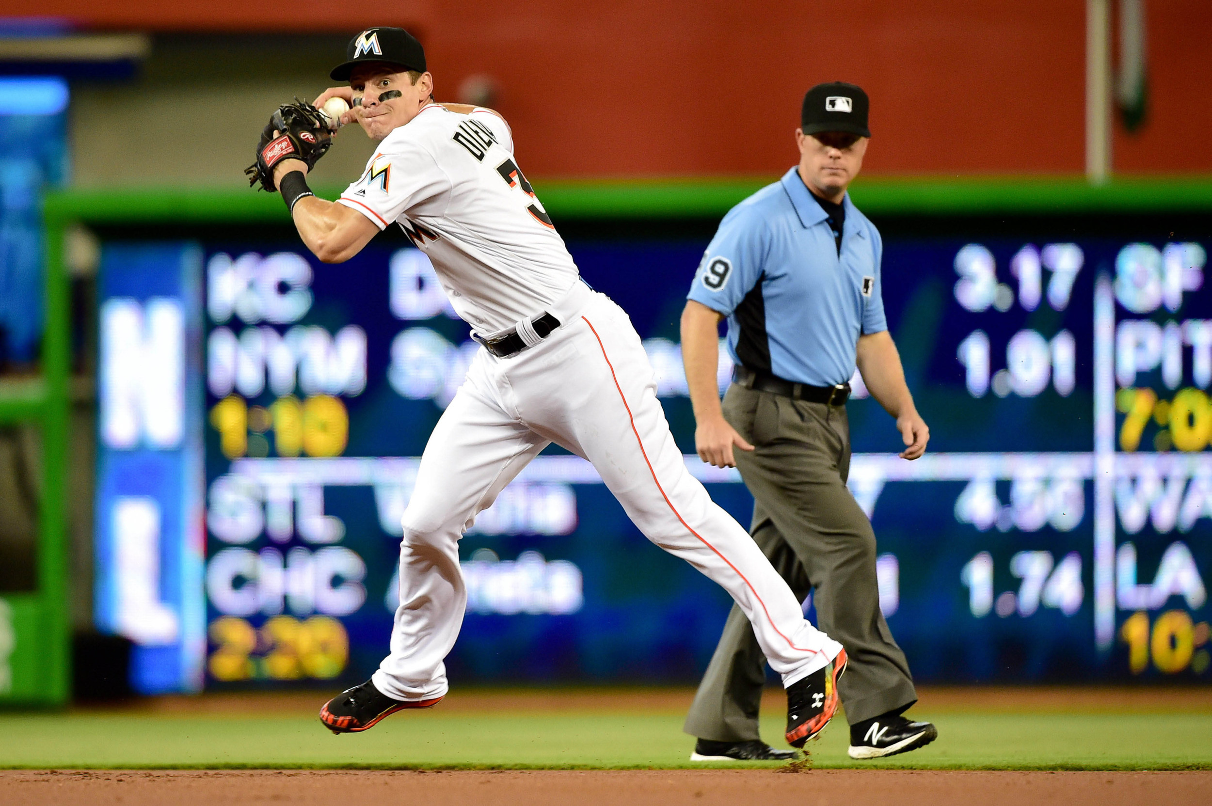 Miami Marlins second baseman Derek Dietrich (32) throws over to first base against the Atlanta Braves. Credit: Steve Mitchell-USA TODAY Sports