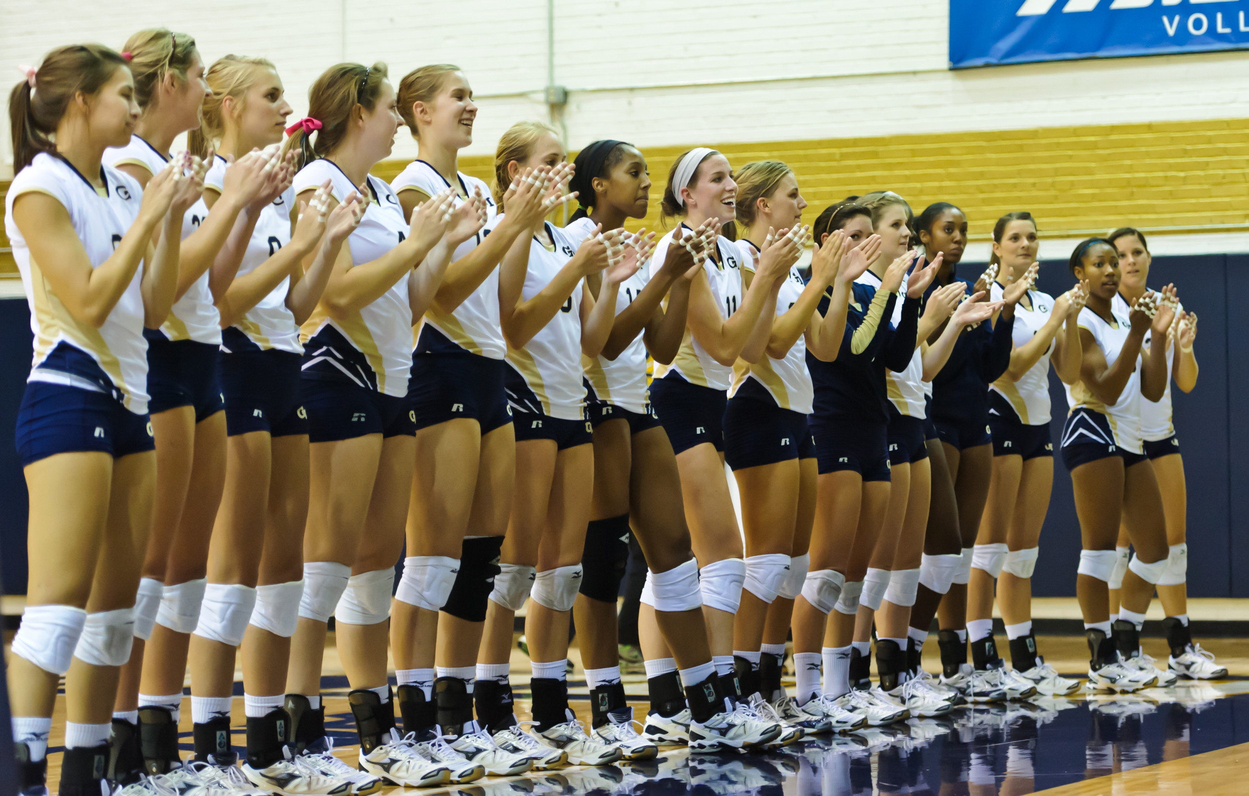 Tech Volleyball players sing the fight song.