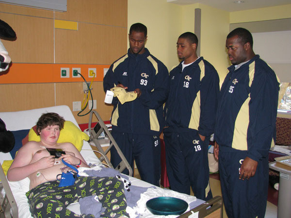 Yellow Jackets visit children at Egleston Hospital.