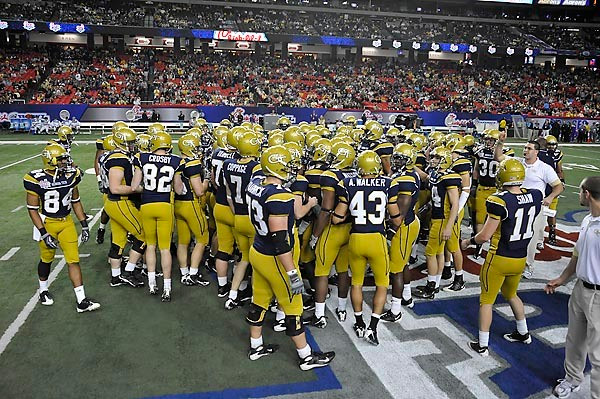 Georgia Tech players rally at mid-field prior to the start of the game against LSU. Photo by LensEffects