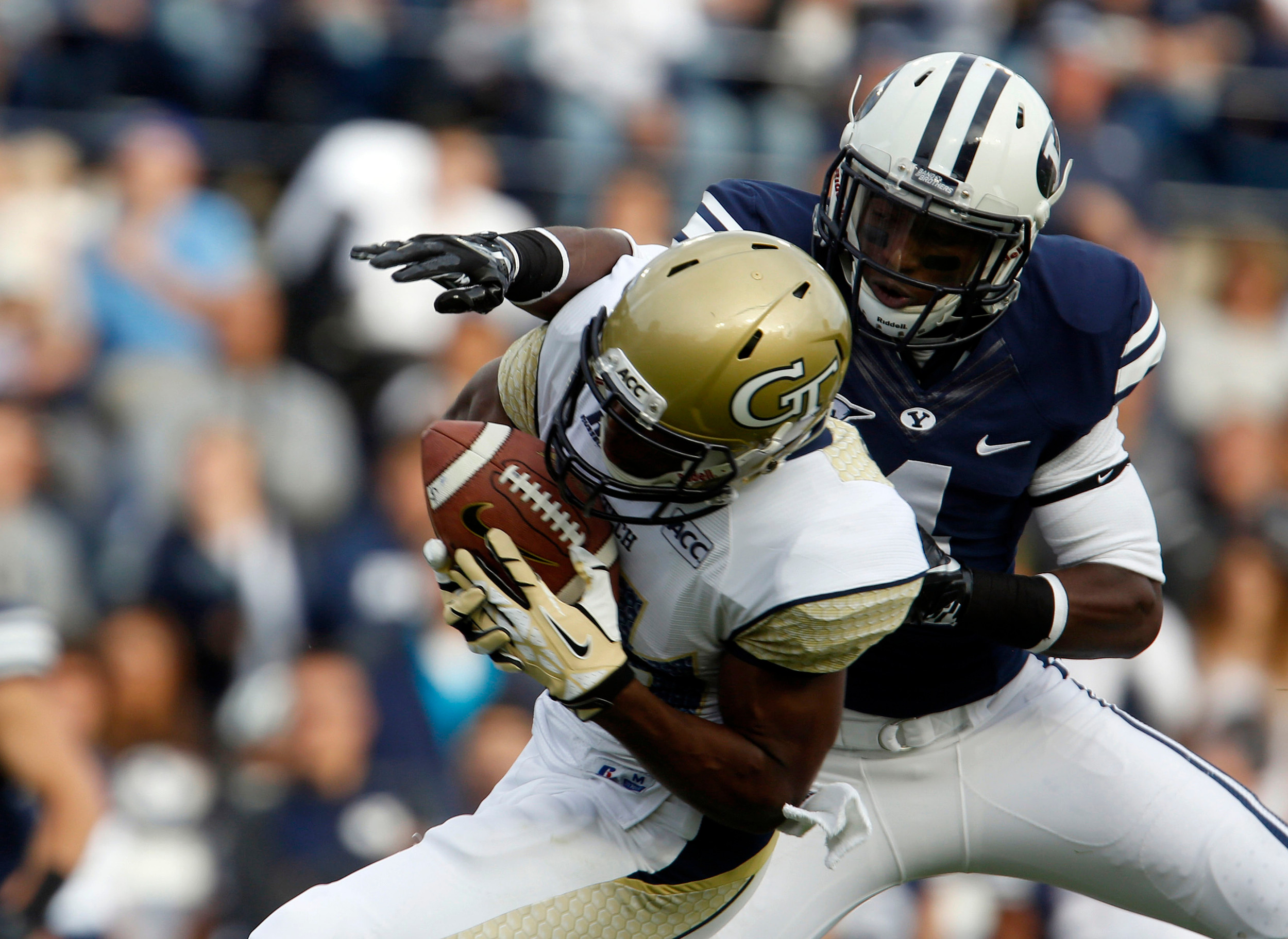 Georgia Tech Yellow Jackets wide receiver Micheal Summers (84) makes a catch while defended by Brigham Young Cougars defensive back Robertson Daniel (4) during the first quarter of a football game at Lavell Edwards Stadium. (Jim Urquhart-USA TODAY Sports)