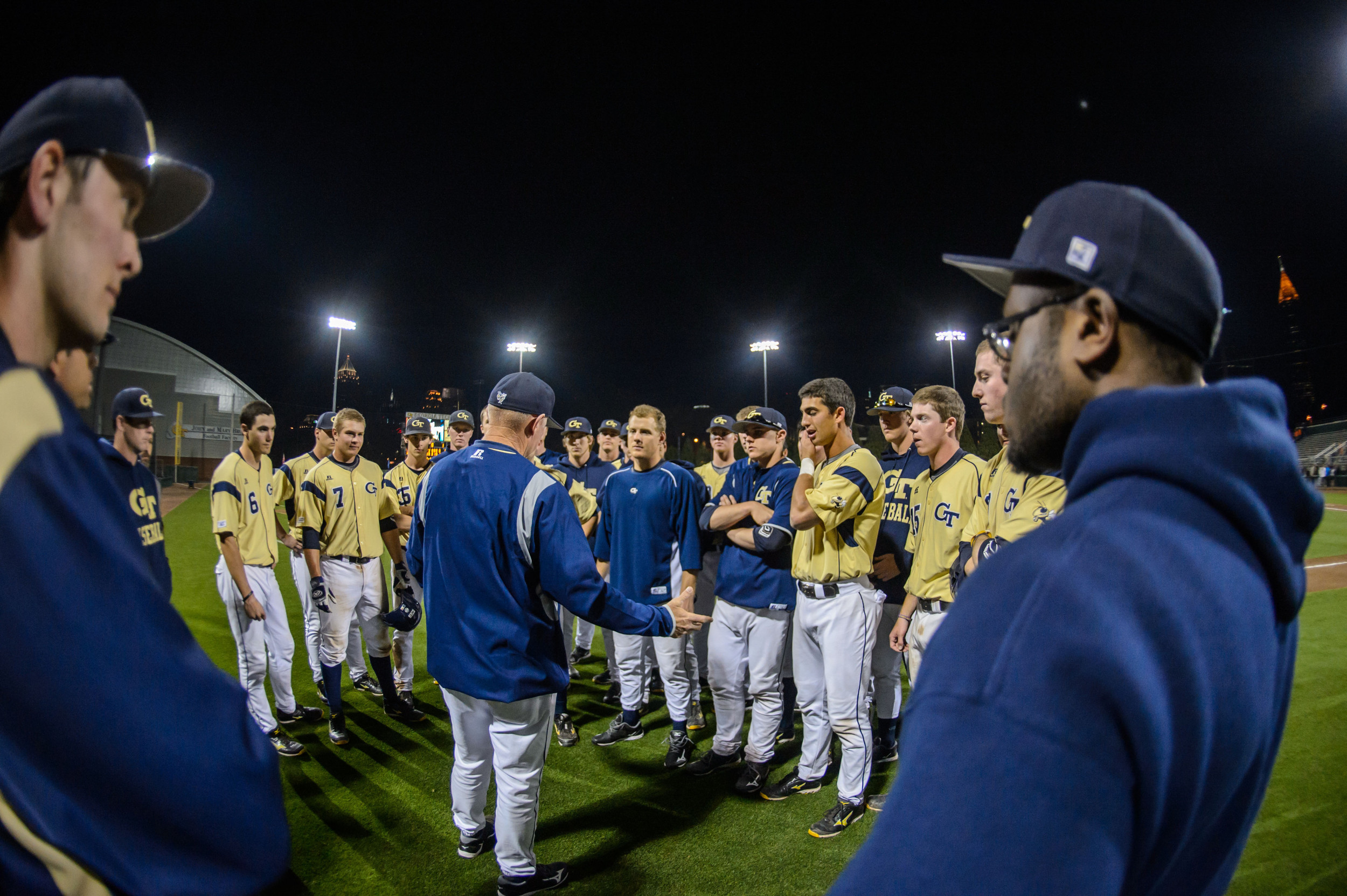 Coach Hall speaks to the team after the win