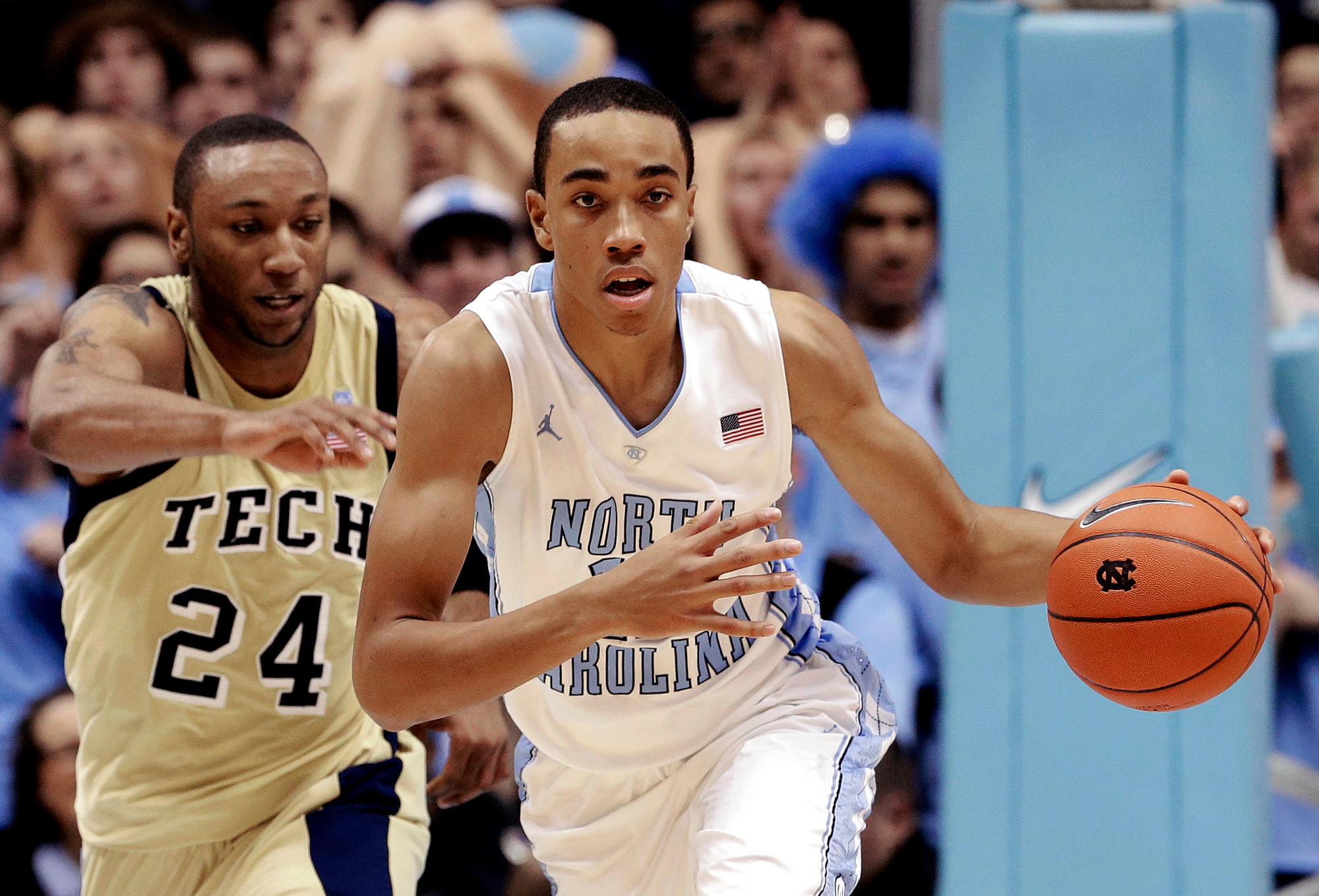 North Carolina's Brice Johnson drives under pressure form Georgia Tech's Kammeon Holsey (24) chases during the first half. (AP Photo/Gerry Broome)