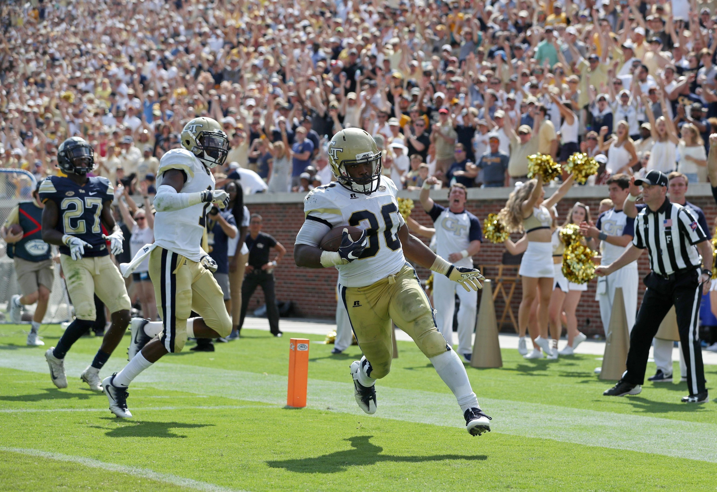 Sep 23, 2017; Atlanta, GA, USA; Georgia Tech Yellow Jackets running back KirVonte Benson (30) scores a 47-yard touchdown run in the fourth quarter against the Pittsburgh Panthers at Bobby Dodd Stadium. Mandatory Credit: Jason Getz-USA TODAY Sports