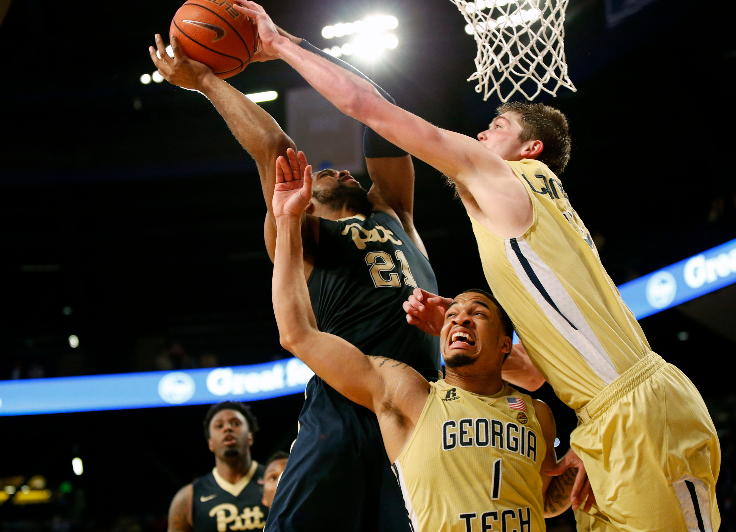Center Ben Lammers blocks the shot of Pittsburgh Panthers forward Sheldon Jeter as guard Tadric Jackson defends in the second half. Georgia Tech won 61-52. Credit: Brett Davis-USA TODAY Sports