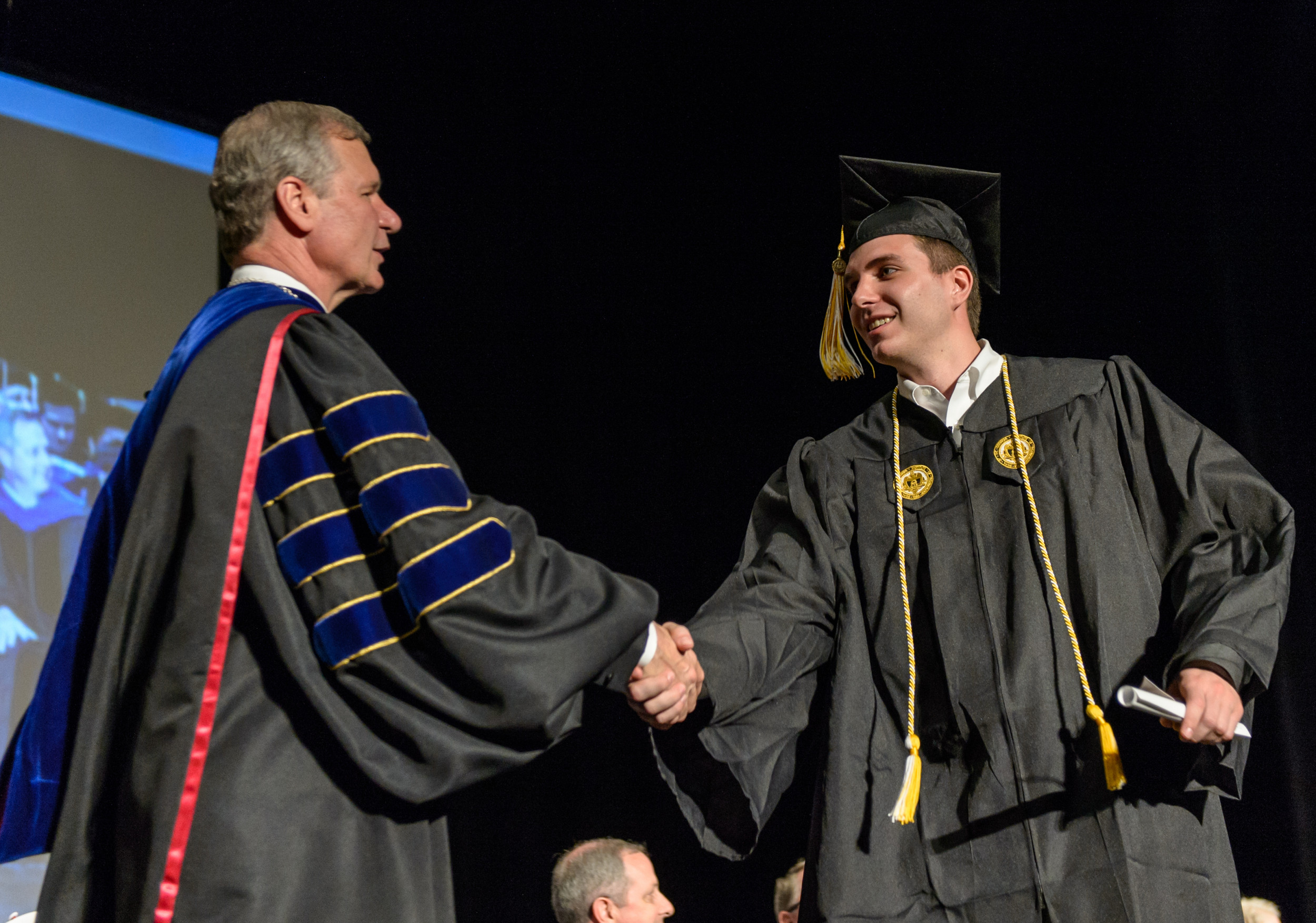 Derek Craig is greeted by Tech president Dr. Bud Peterson