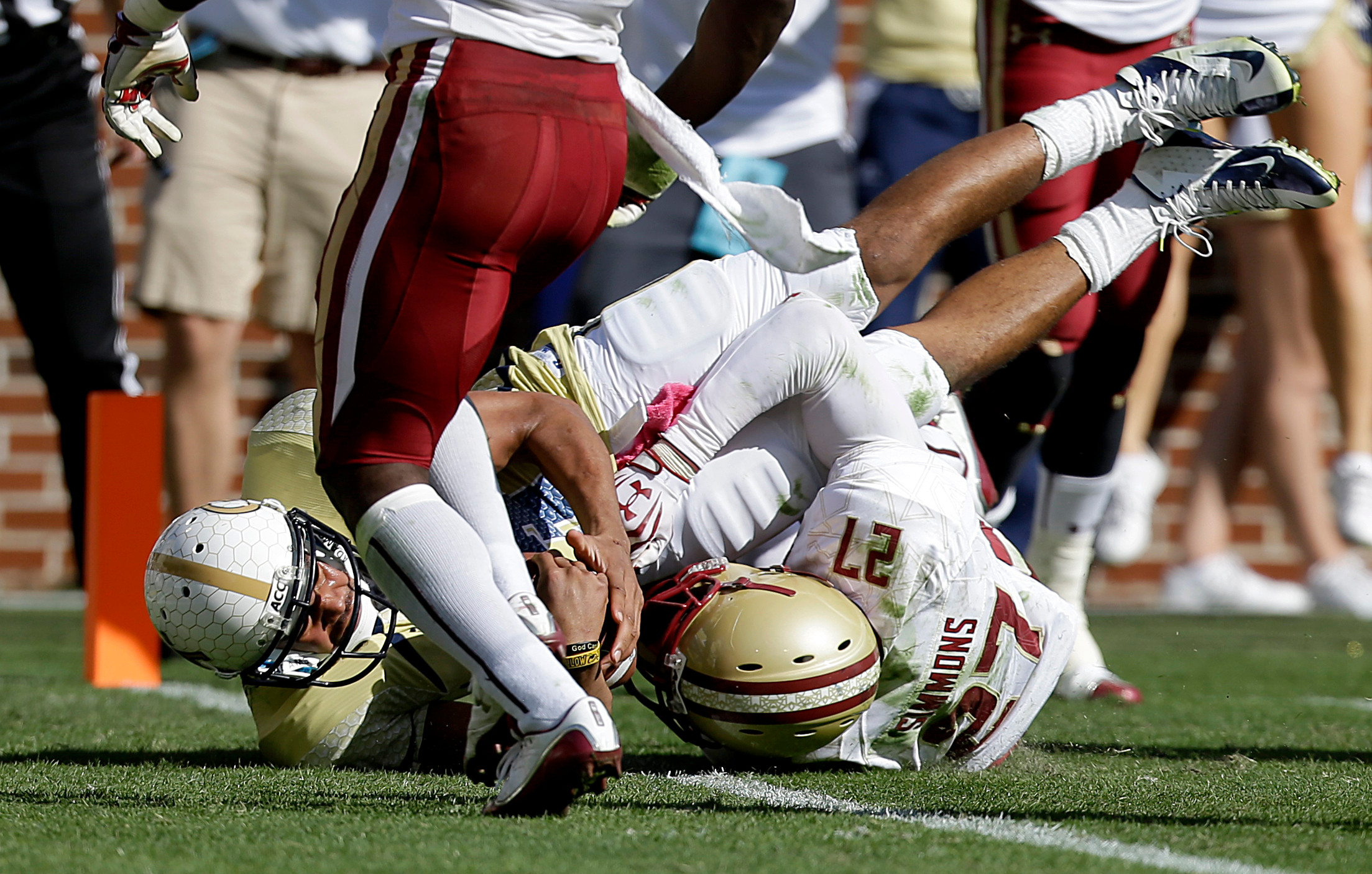 Georgia Tech quarterback Tevin Washington, left, dives into the end zone to score a touchdown against the defense of Boston College defensive back Justin Simmons right, in the first quarter. Georgia Tech won 37-17. (AP Photo/David Goldman)