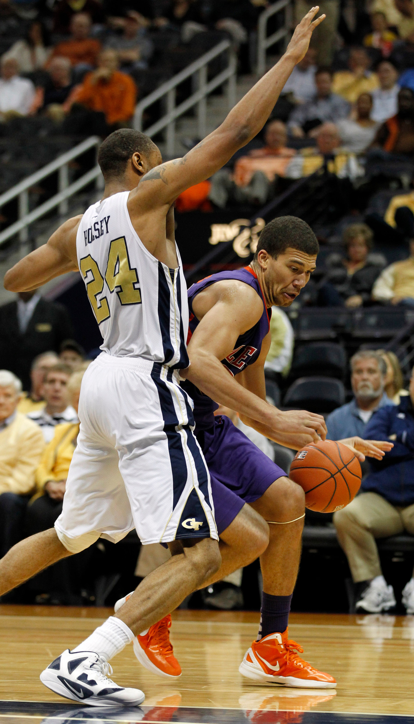 Clemson forward Milton Jennings (24) drives around Georgia Tech forward Kammeon Holsey (24) in the first half of an NCAA college basketball game, Tuesday, Feb. 21, 2012, in Atlanta. (AP Photo/John Bazemore)