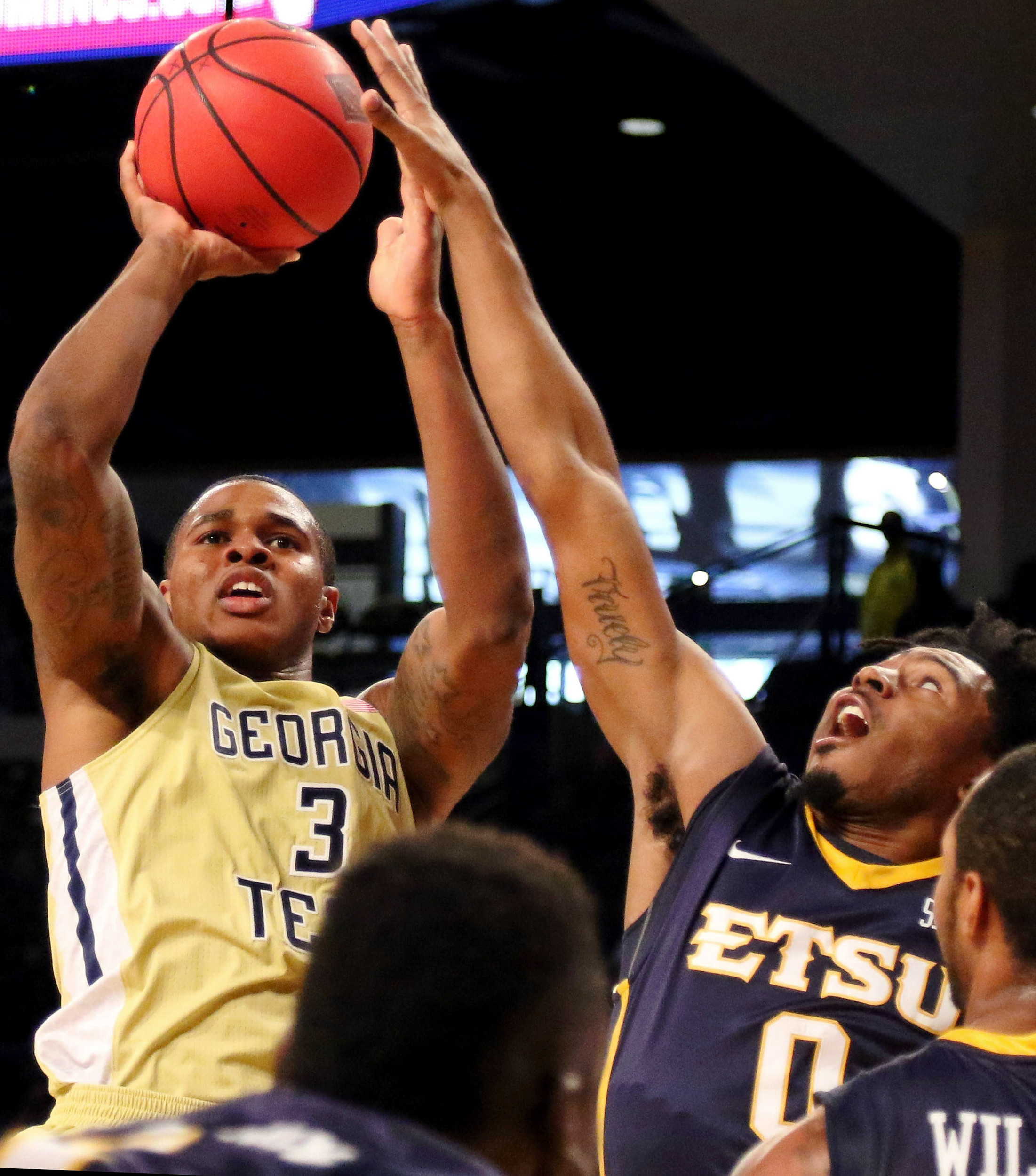 Nov 22, 2015; Atlanta, GA, USA; Georgia Tech Yellow Jackets forward Marcus Georges-Hunt (3) shoots the ball over East Tennessee State Buccaneers guard T.J. Cromer (0) in the first half at McCamish Pavilion. Mandatory Credit: Brett Davis-USA TODAY Sports