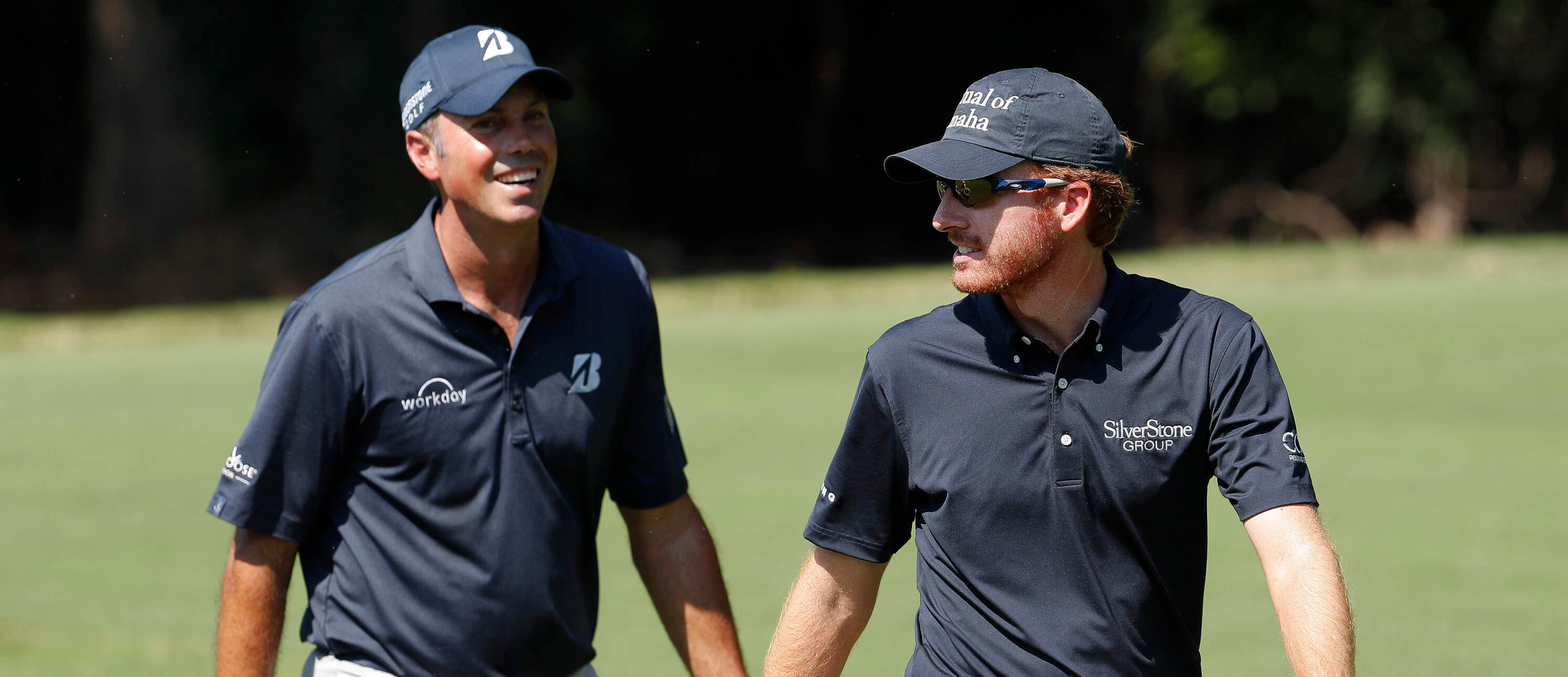 Former Georgia Tech golfers, Matt Kuchar, left, and Roberto Castro chat as they walk to the second green during the final round of play at the Tour Championship golf tournament at East Lake Golf Club Sunday, Sept. 25, 2016, in Atlanta. (AP Photo/John Bazemore)