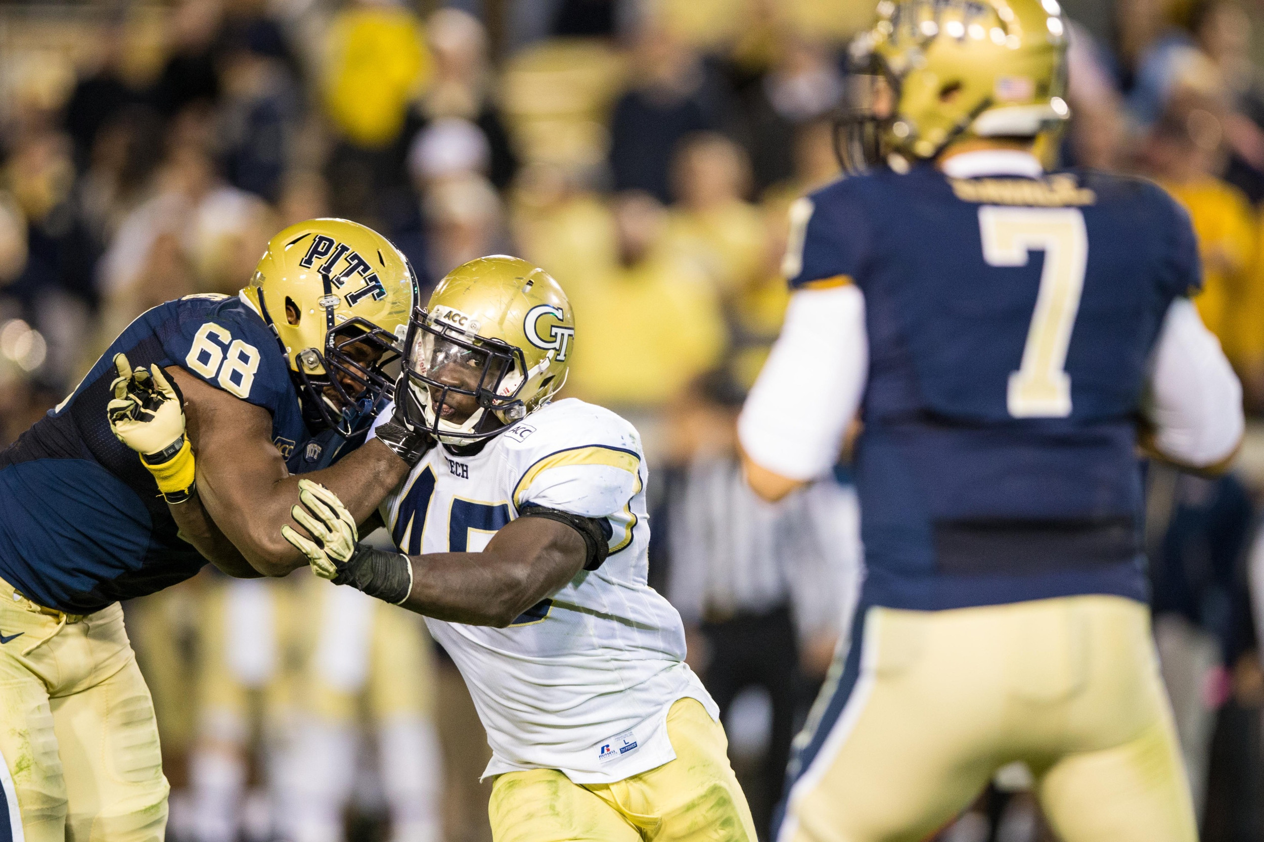 Georgia Tech Yellow Jackets defensive end Jeremiah Attaochu (45) tries to get around Pittsburgh Panthers offensive linesman T.J. Clemmings (68) in his pursuit of quarterback Tom Savage (7) during the fourth quarter at Bobby Dodd Stadium. Tech won 21-10. Mandatory Credit: Kevin Liles-USA TODAY Sports