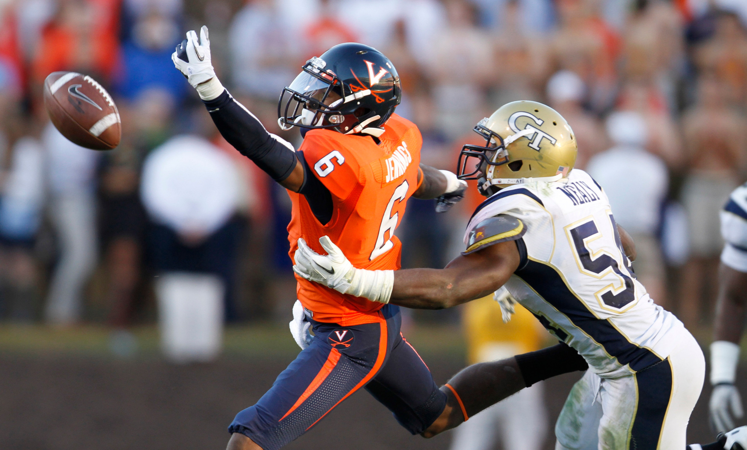 Virginia wide receiver Darius Jennings (6) misses a pass as Georgia Tech linebacker Quayshawn Nealy (54) defends during the second half. (AP Photo/Steve Helber)
