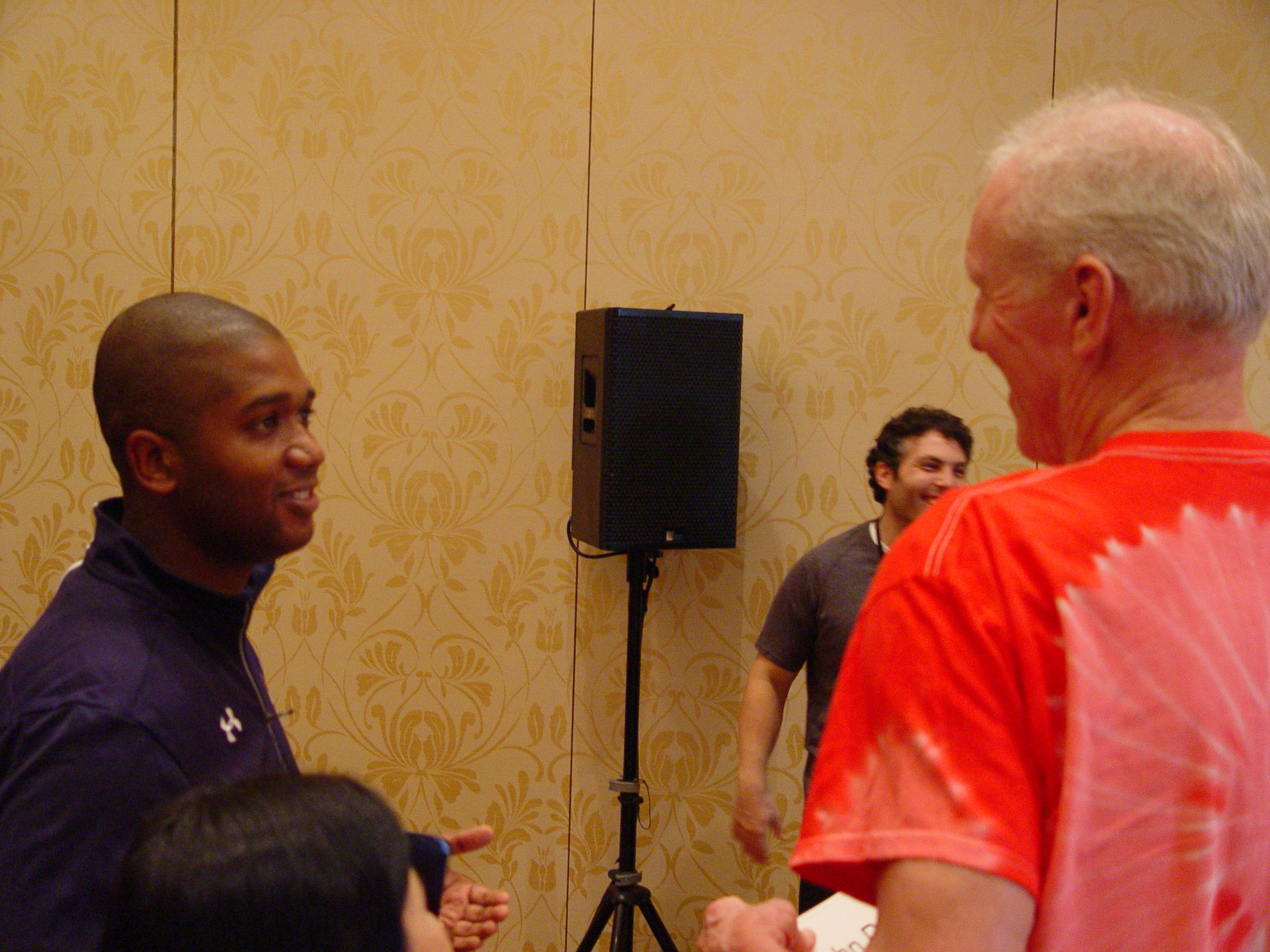 Associate AD Marvin Lewis chats with Bill Walton following Disney Press Conference, November 8, 2017