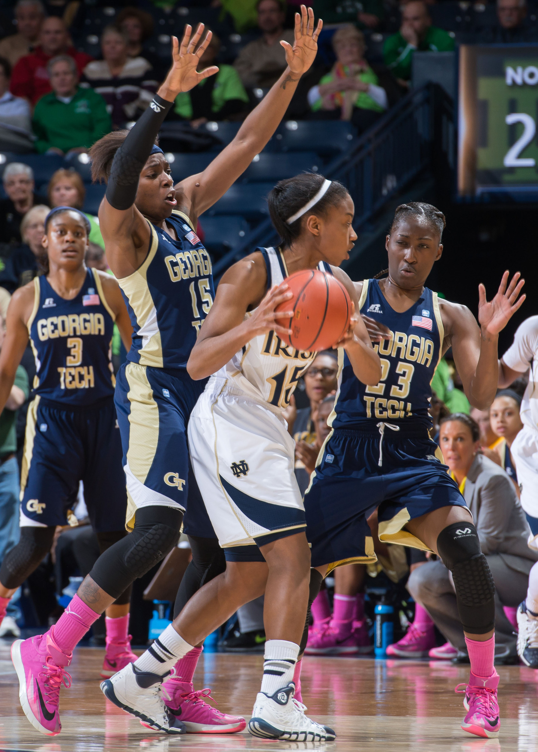 Feb 17, 2014; South Bend, IN, USA; Notre Dame Fighting Irish guard Lindsay Allen (15) holds the ball as Georgia Tech Yellow Jackets guard Tyaunna Marshall (15) and guard Syndey Wallas (23) defend in the first half at the Purcell Pavilion. Mandatory Credit: Matt Cashore-USA TODAY Sports