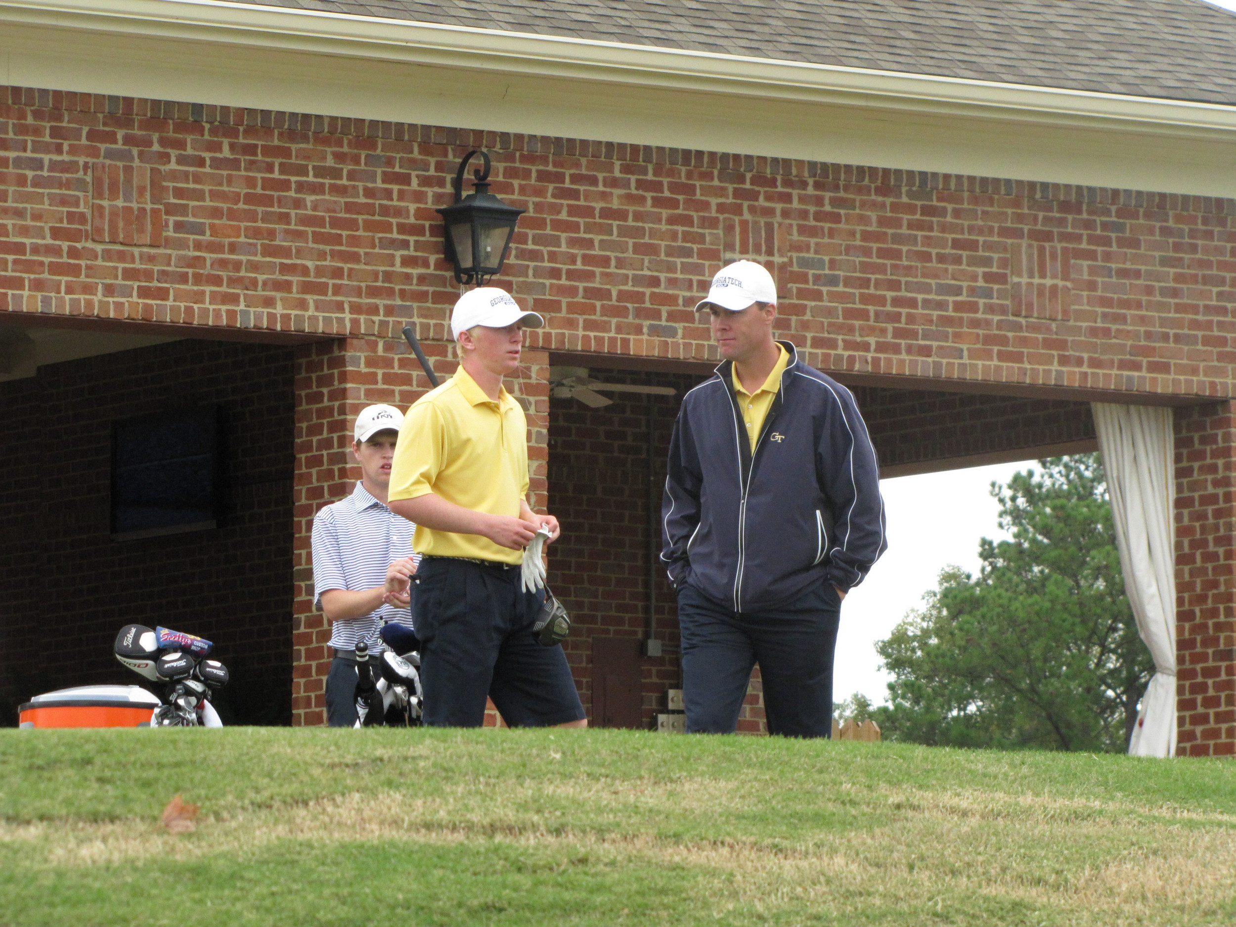 Anders Albertson chats with assistant coach Christian Newton during the final round of the Brickyard Collegiate - October 9, 2011.
