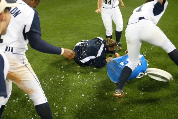 The team gives head coach Sharon Perkins an ice bath