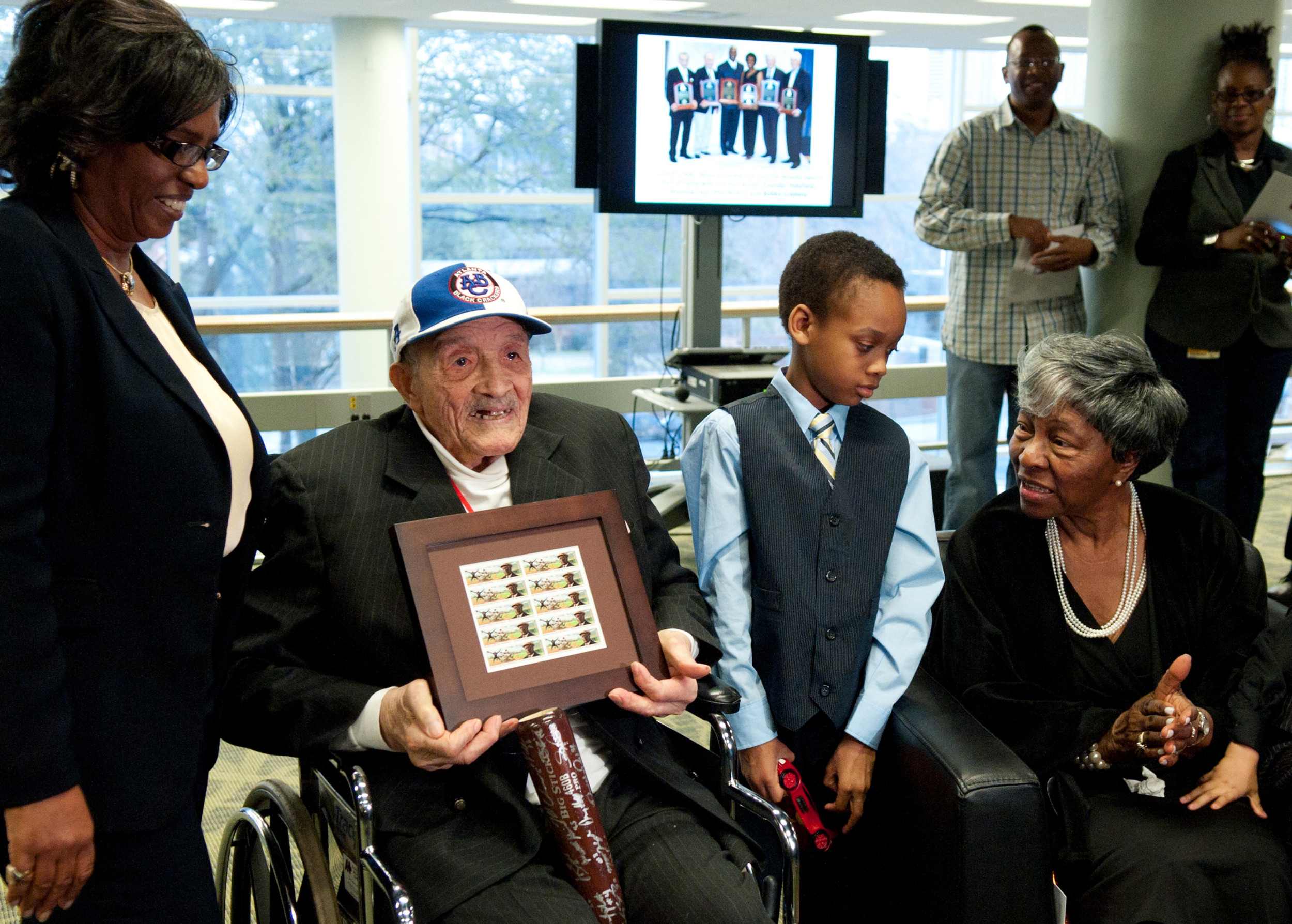 The Shades of Greatness art exhibit and panel discussion provided the campus with an opportunity to reflect on African American history and culture through the lens of sports. The reception for James "Red" Moore was held in the library after the discussion.