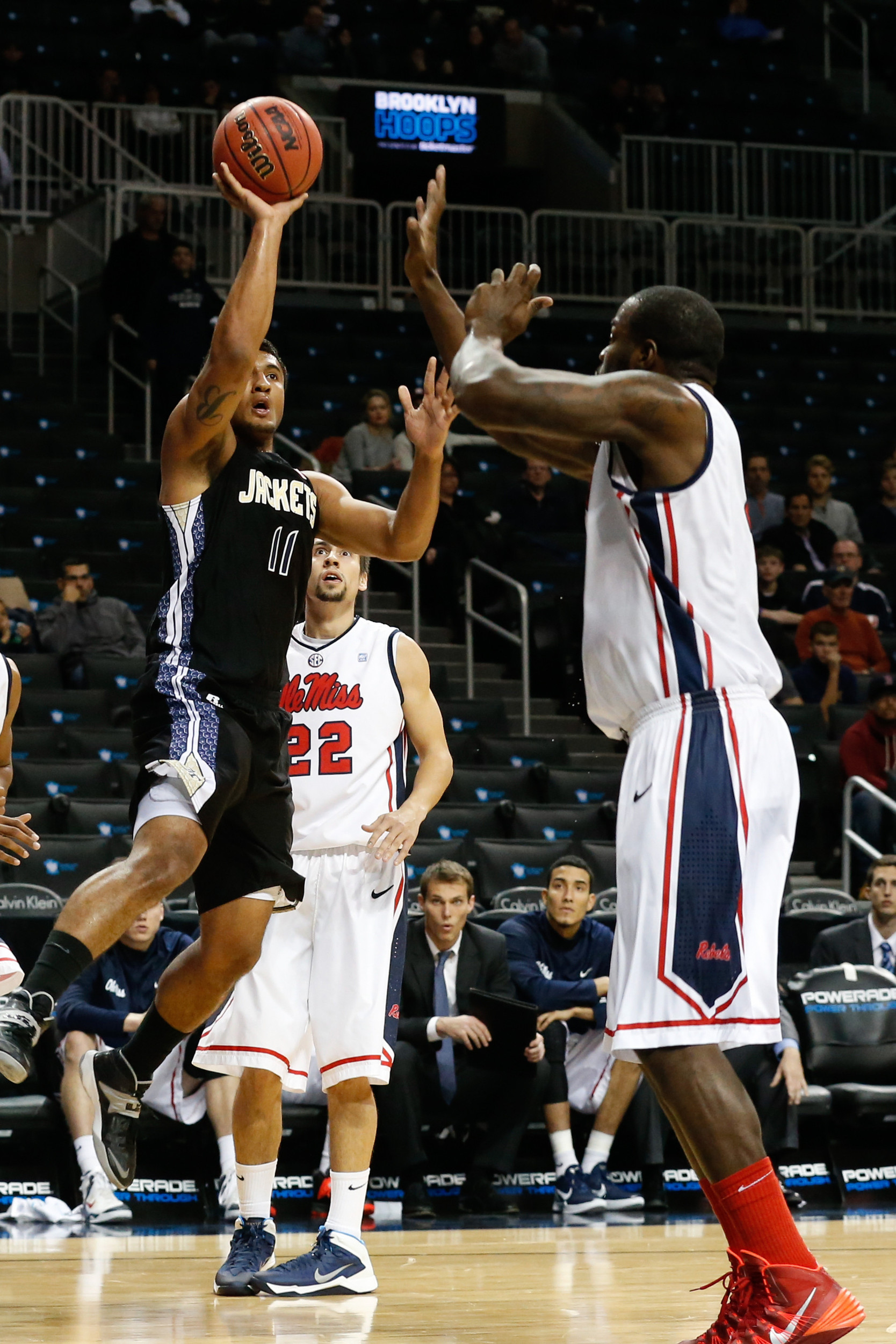 Nov 29, 2013; Brooklyn, NY, USA; Georgia Tech Yellow Jackets guard Chris Bolden (11) shoots over Mississippi Rebels center Demarco Cox (4) during the first half at Barclays Center. Mandatory Credit: Anthony Gruppuso-USA TODAY Sports