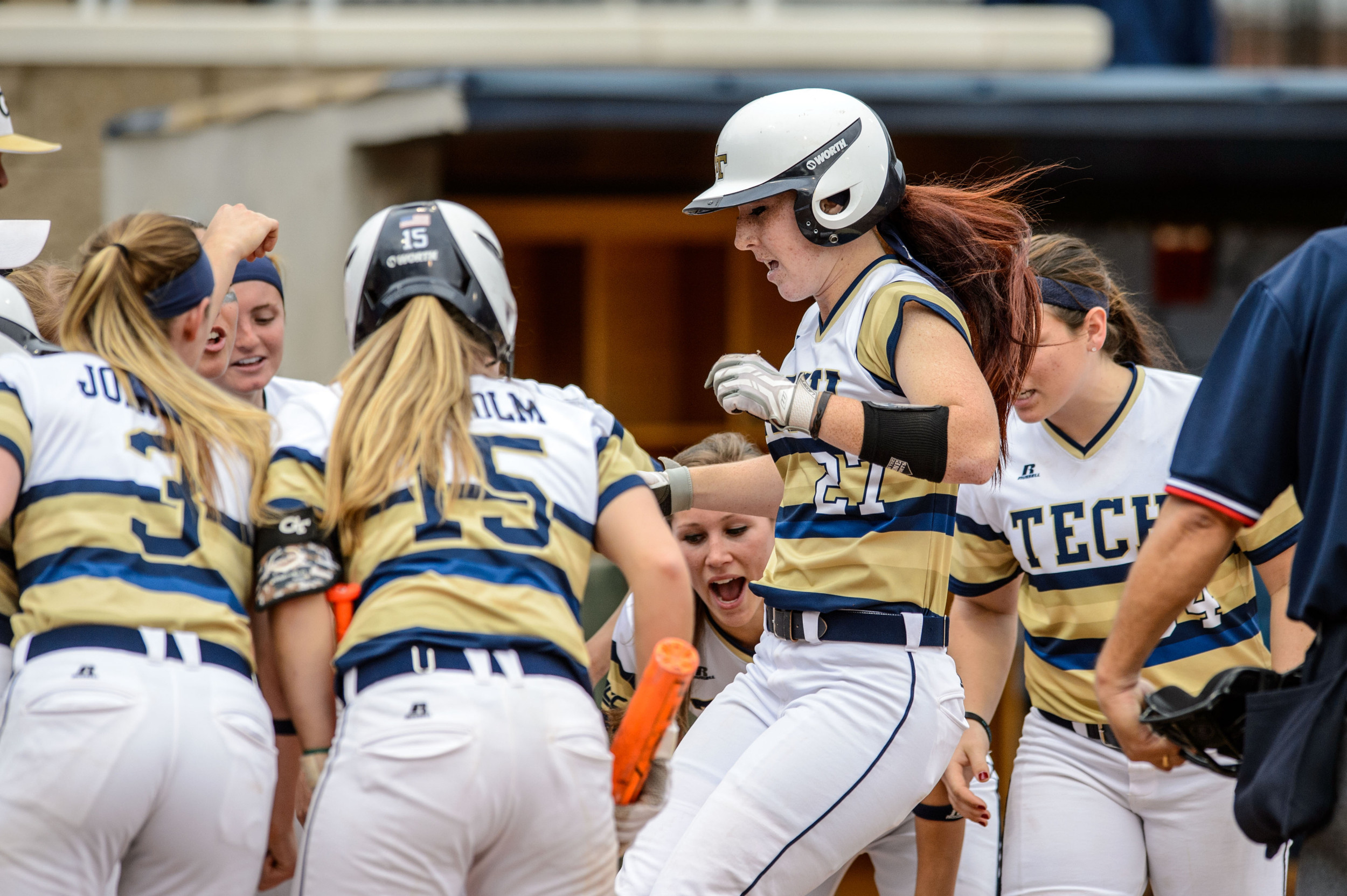 Courtney Ziese (27) is welcomed back to the plate by her teammates after a home run