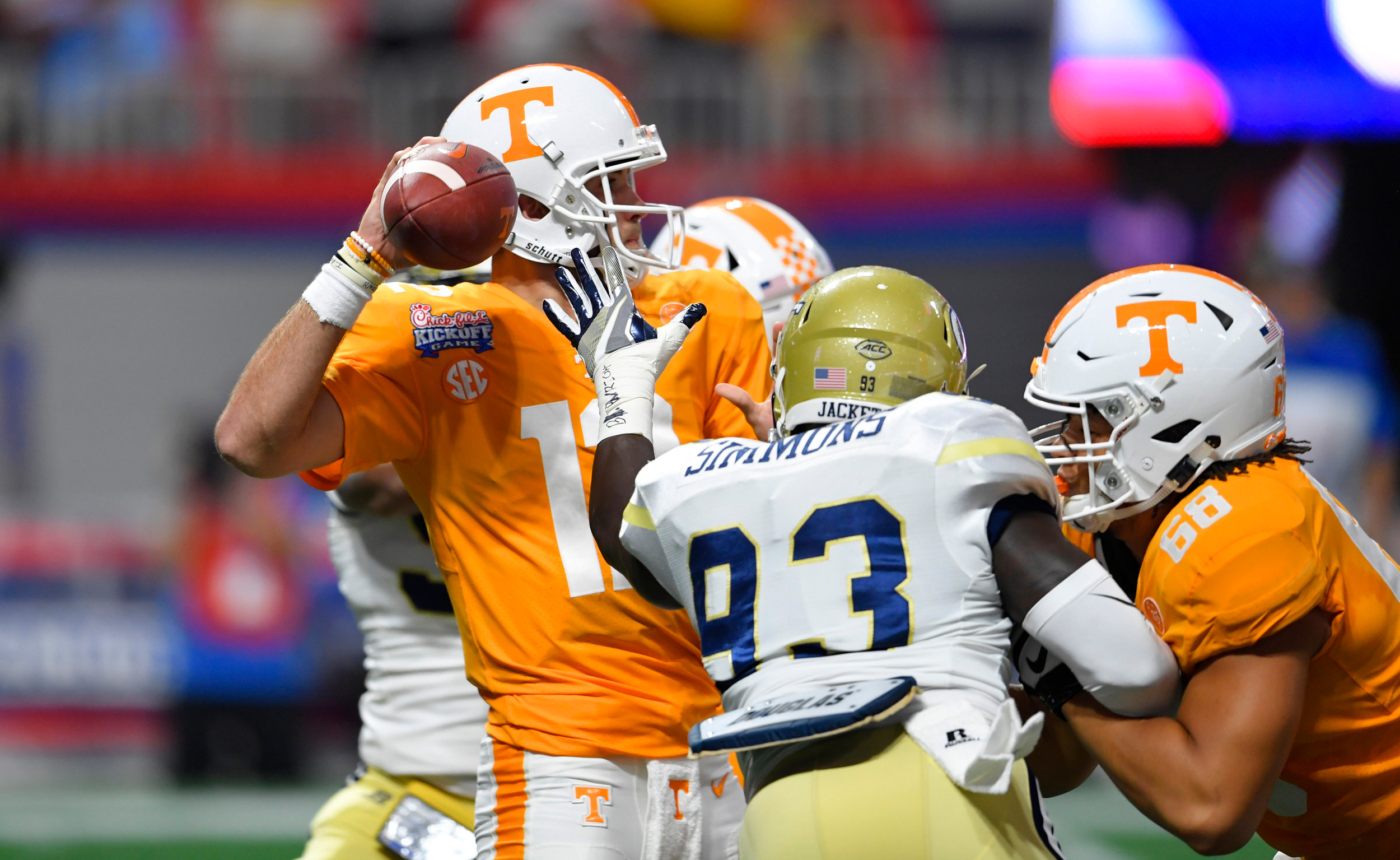 Sep 4, 2017; Atlanta, GA, USA; Tennessee Volunteers quarterback Quinten Dormady (12) drops back to pass against pressure from Georgia Tech Yellow Jackets defensive lineman Antonio Simmons (93) during the first quarter at Mercedes-Benz Stadium. Mandatory Credit: Dale Zanine-USA TODAY Sports