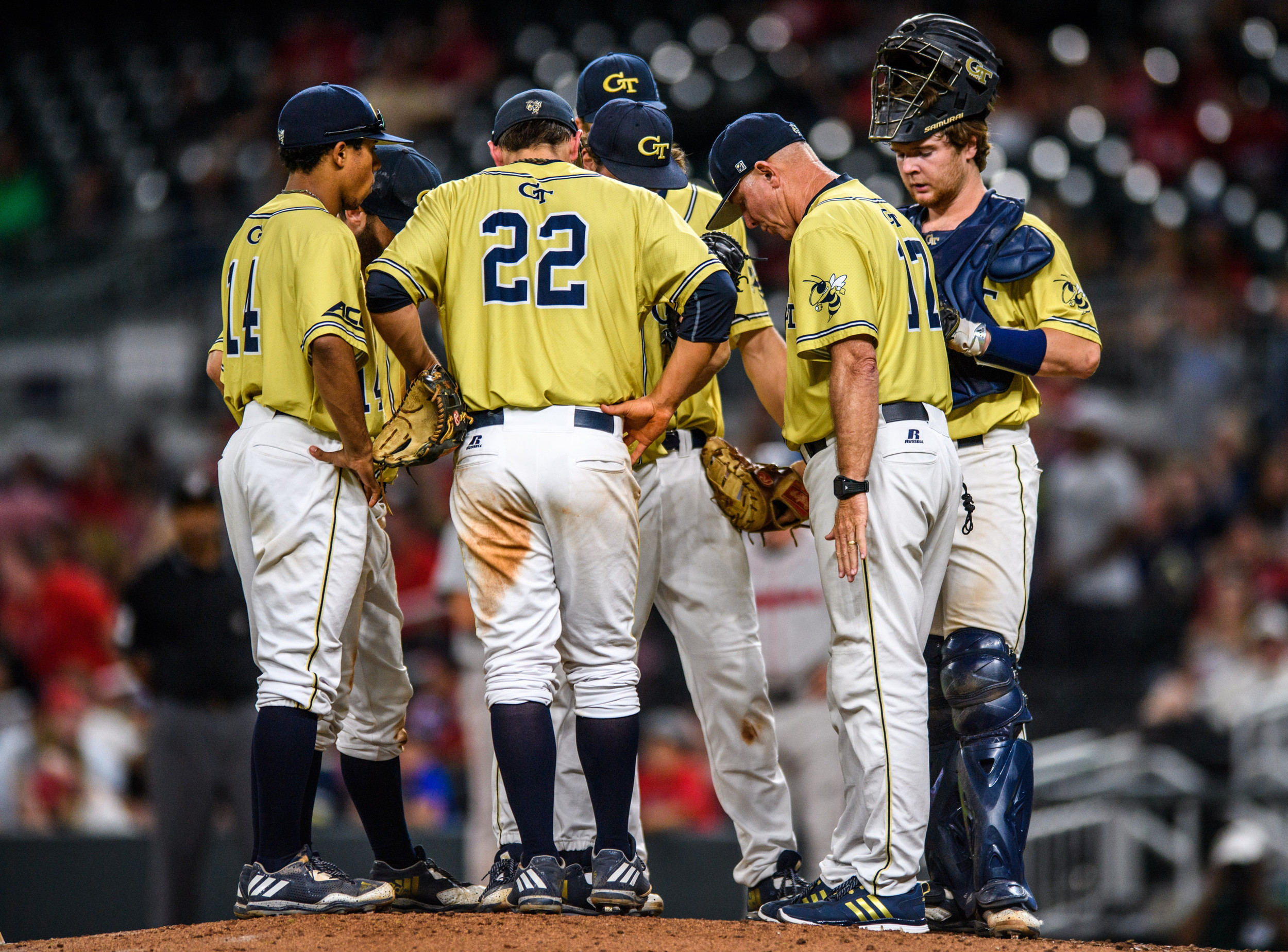 Coach Hall speaks to the infield