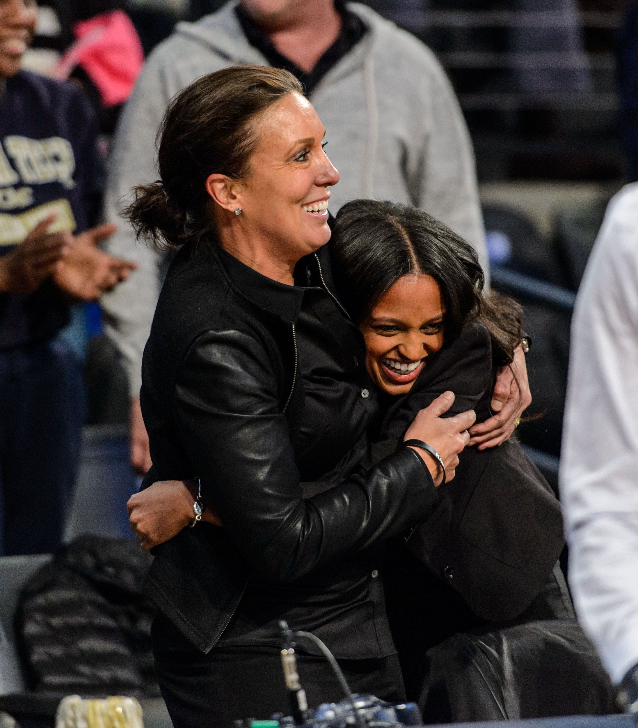 Coach MaChelle Joseph and Radio Color Commentator Hannah Joy share an embrace after the win