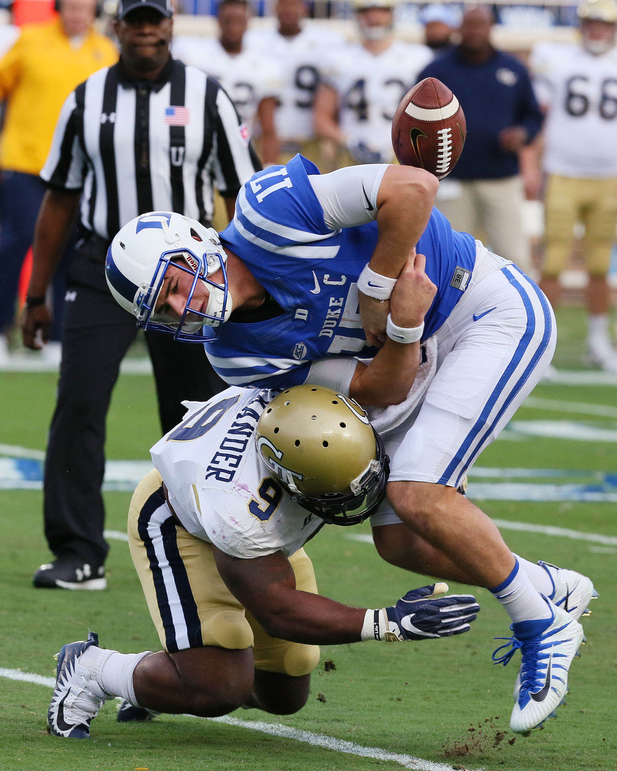 Nov 18, 2017; Durham, NC, USA; Georgia Tech Yellow Jackets linebacker Victor Alexander (9) knocks the ball from Duke Blue Devils quarterback Daniel Jones (17) for a fumble in the first half at Wallace Wade Stadium. The fumble was recovered by Duke. Mandatory Credit: Mark Dolejs-USA TODAY Sports