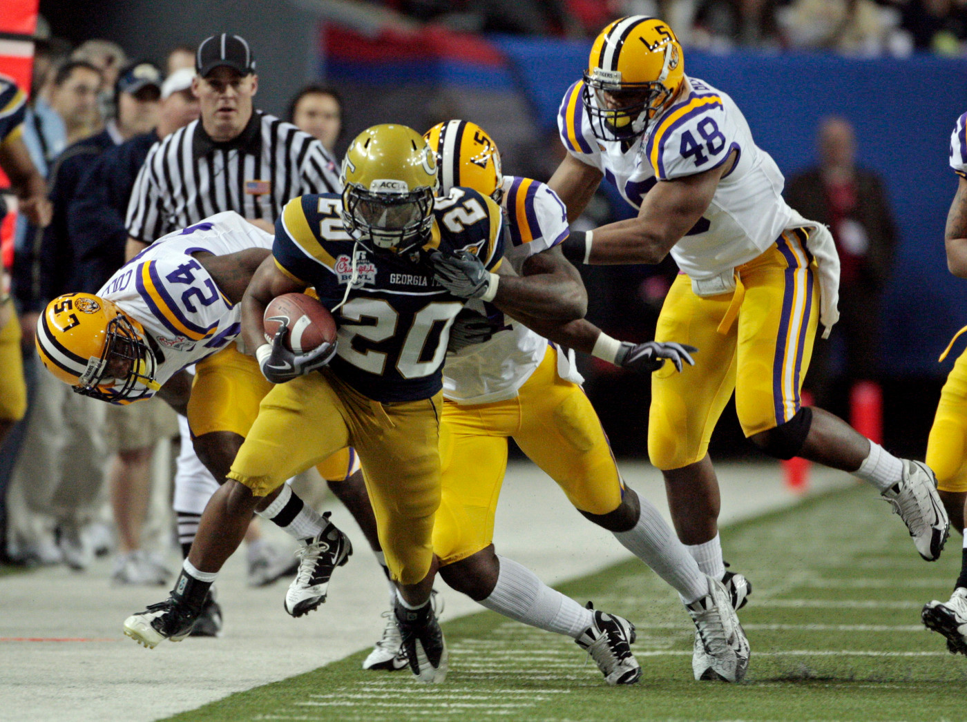 Georgia Tech's Roddy Jones (20) is forced out of bounds by LSU players Harry Coleman (24), Kelvin Sheppard (11) and Darry Beckwith (48) during the Chick-fil-A Bowl NCAA college football game at the Georgia Dome in Atlanta Wednesday, Dec. 31, 2008 in Atlanta. (AP Photo/Dave Martin)