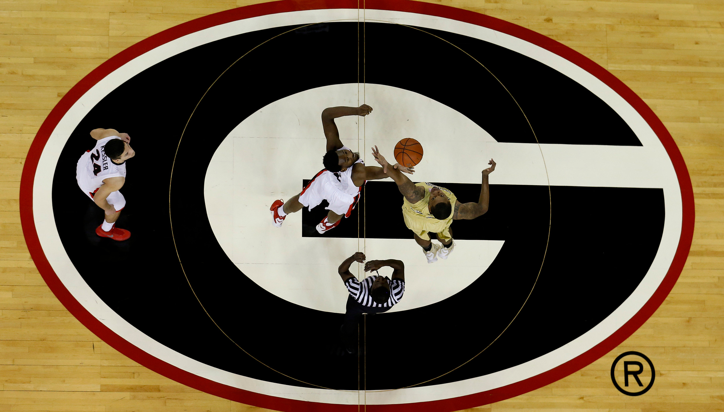 Georgia Bulldogs forward Yante Maten (1) and Georgia Tech Yellow Jackets forward Nick Jacobs (32) take the opening tipoff at the start of the game at Stegeman Coliseum. Mike Zarrilli-USA TODAY Sports