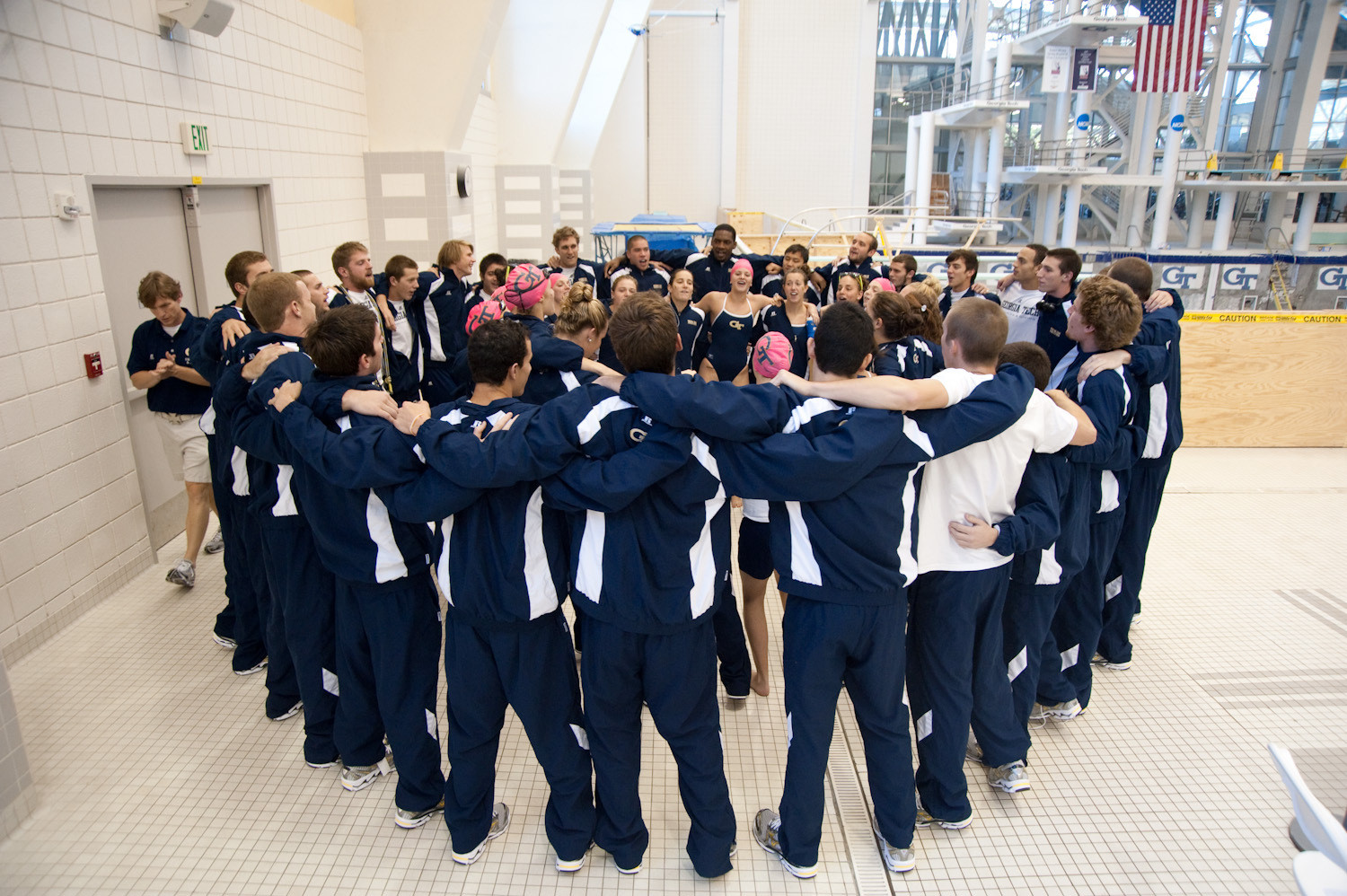 Swimming and Diving vs. WKU and FAUThe team huddles prior to the start of the meet
