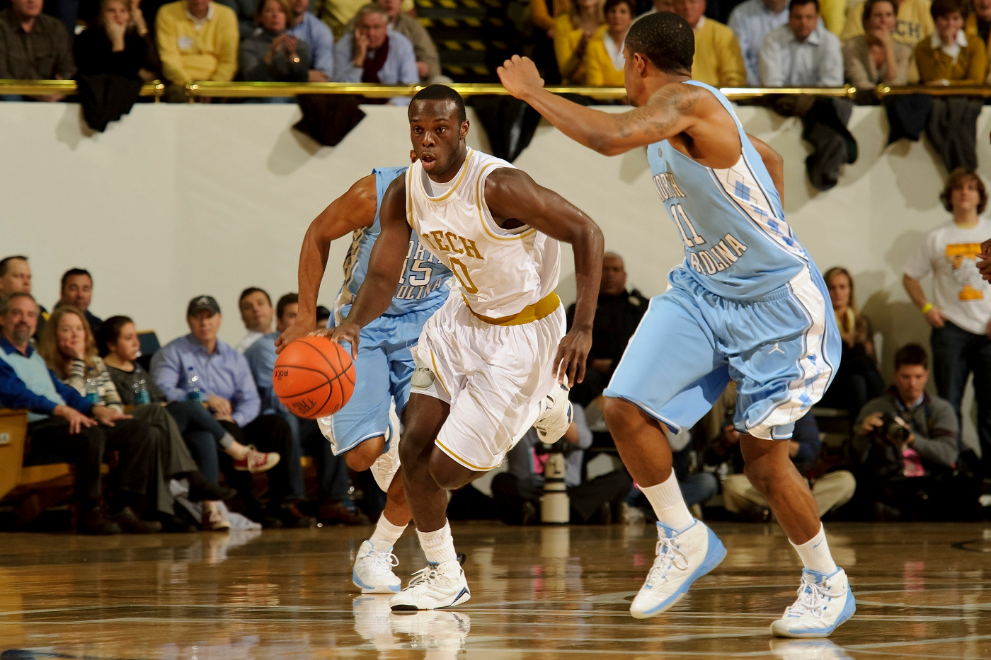 Feb 16, 2010; Atlanta, GA, USA; Georgia Tech Yellow Jackets guard Mfon Udofia (0) brings the ball up the court against North Carolina Tarheels guard Larry Drew II (11) during the first half at Alexander Memorial Coliseum. Georgia Tech defeated North Carolina 68-51.