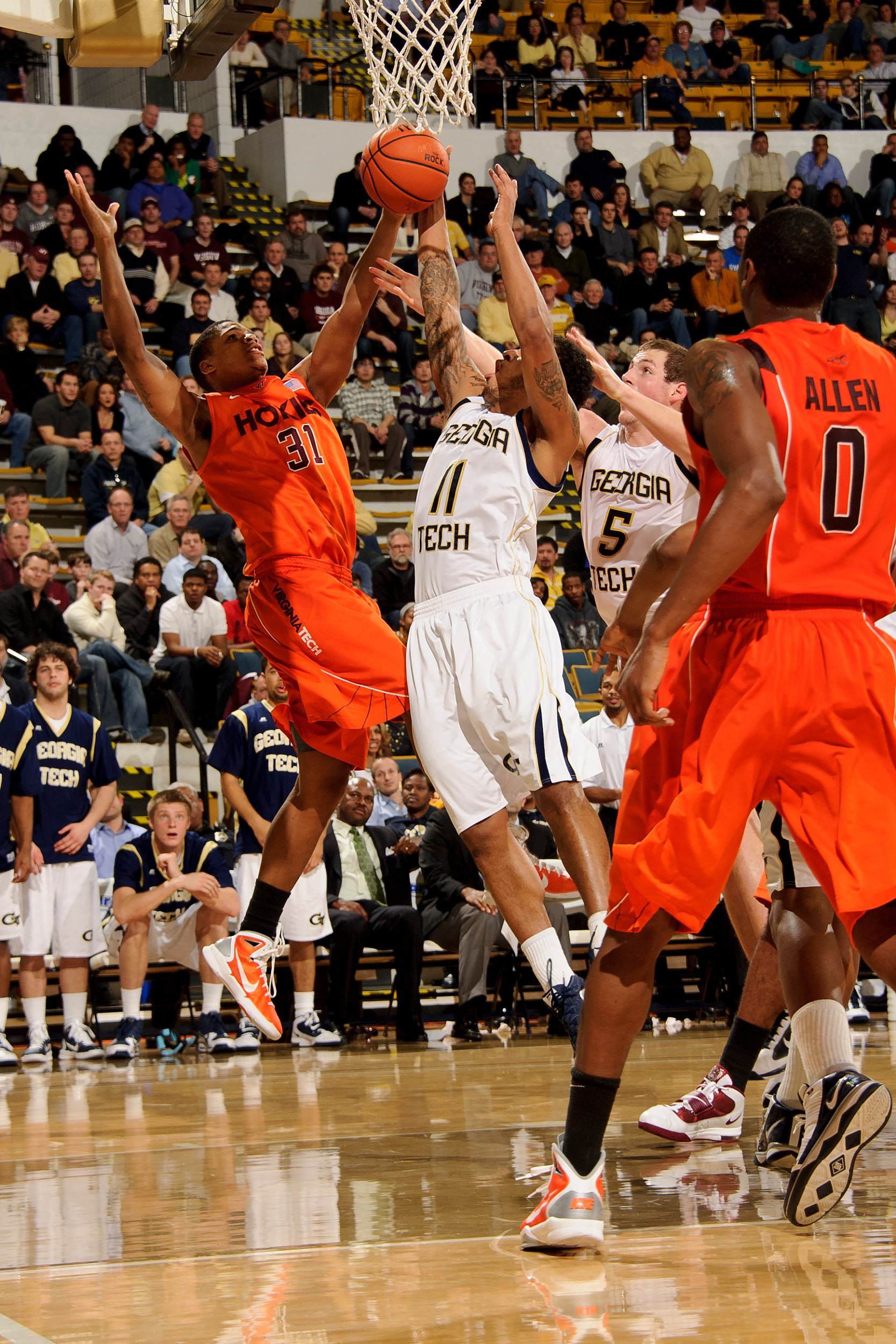 Jan 25, 2011; Atlanta, GA, USA; Virginia Tech Hokies guard/forward Jarell Eddie (31) and Georgia Tech Yellow Jackets guard/forward Brian Oliver (11) fight for a rebound during the second half at Alexander Memorial Coliseum. Georgia Tech defeated Virginia Tech 72-57. Mandatory Credit: Paul Abell-US PRESSWIRE