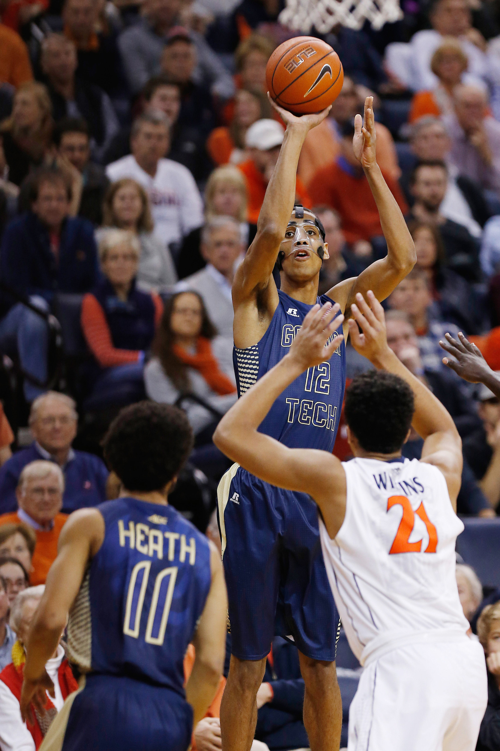 Yellow Jackets forward Quinton Stephens (12) shoots the ball over Virginia Cavaliers forward Isaiah Wilkins (21) Geoff Burke-USA TODAY Sports