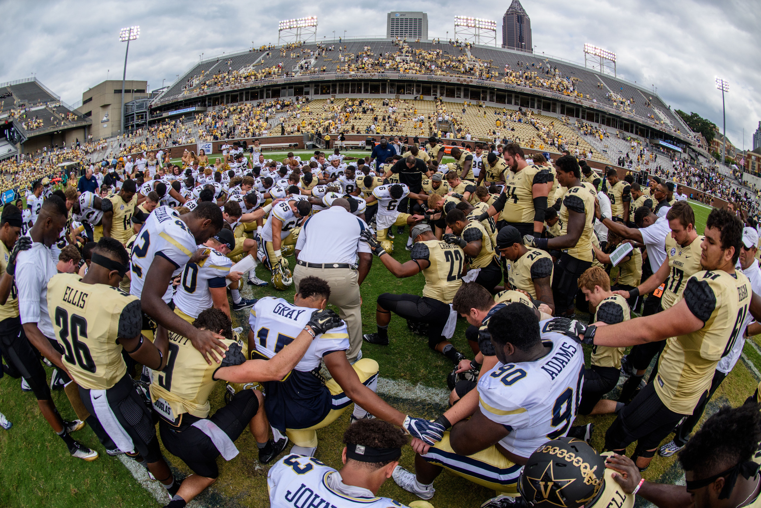 Players huddle at midfield