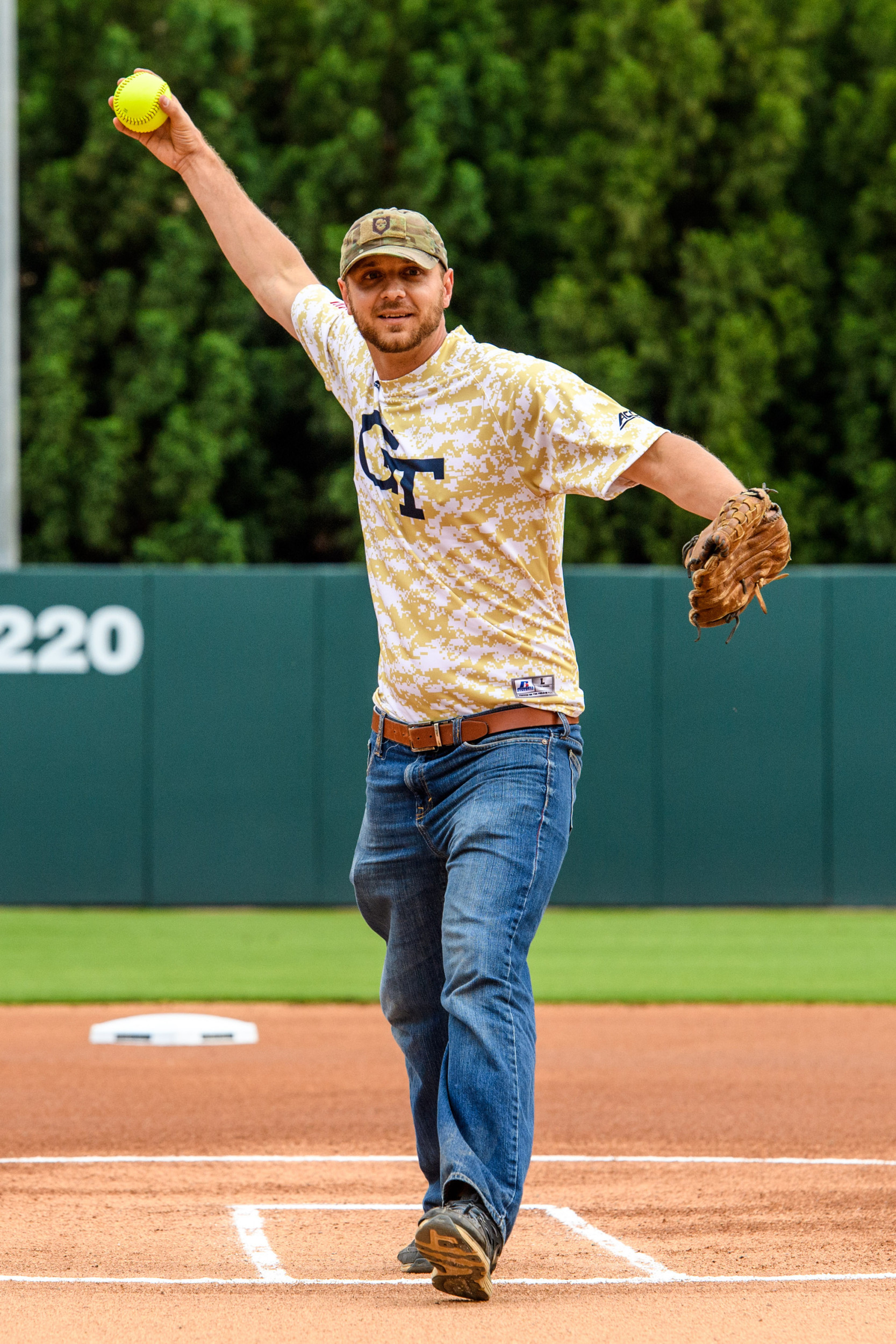 Former Navy SEAL Jason Kuhn threw out the first pitch of the Salute to Service game