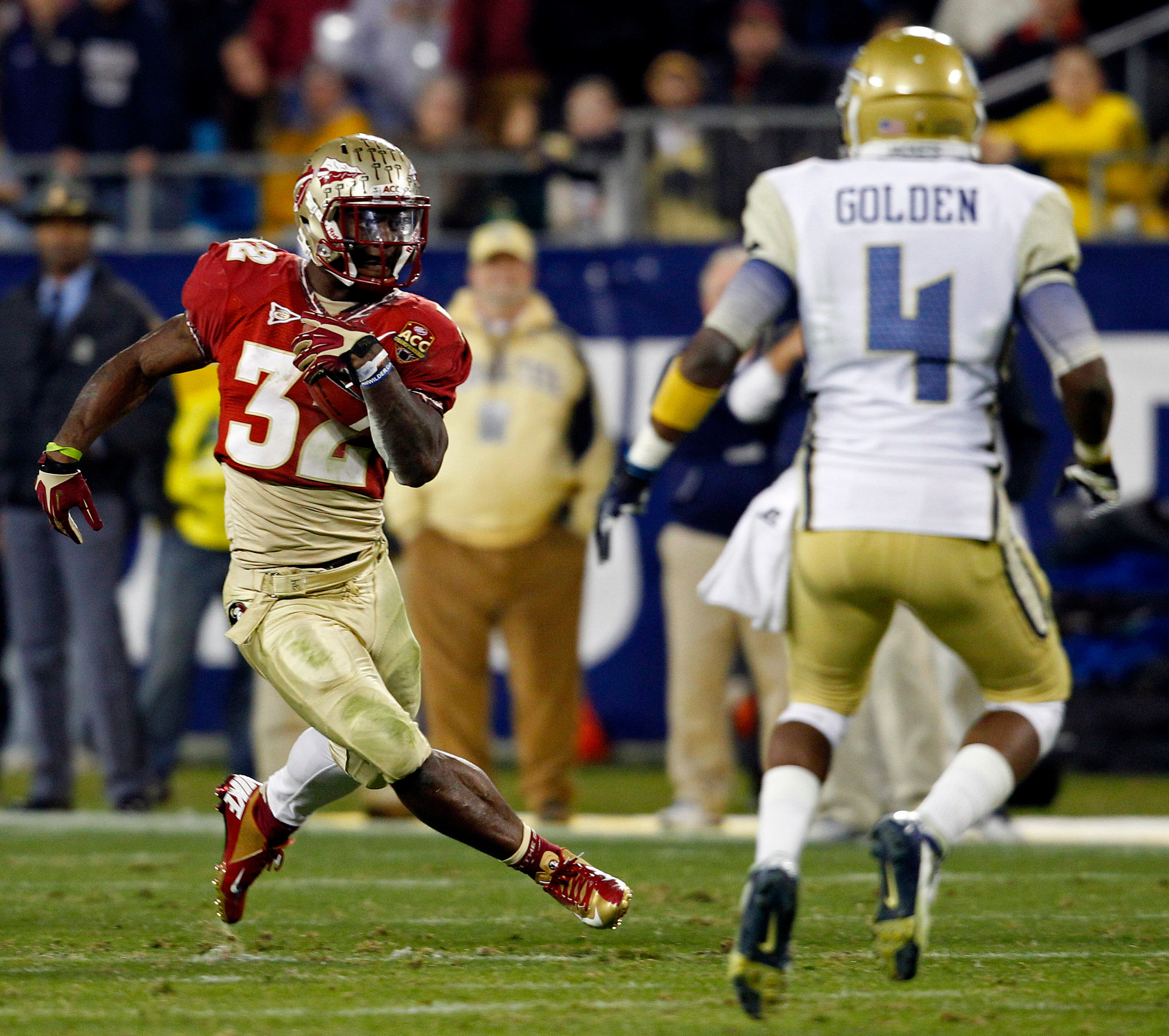Florida State's James Wilder Jr. (32) carries as Georgia Tech's Jamal Golden (4) defends during the second half of the Atlantic Coast Conference championship NCAA college football game in Charlotte, N.C., Saturday, Dec. 1, 2012. (AP Photo/Chuck Burton)