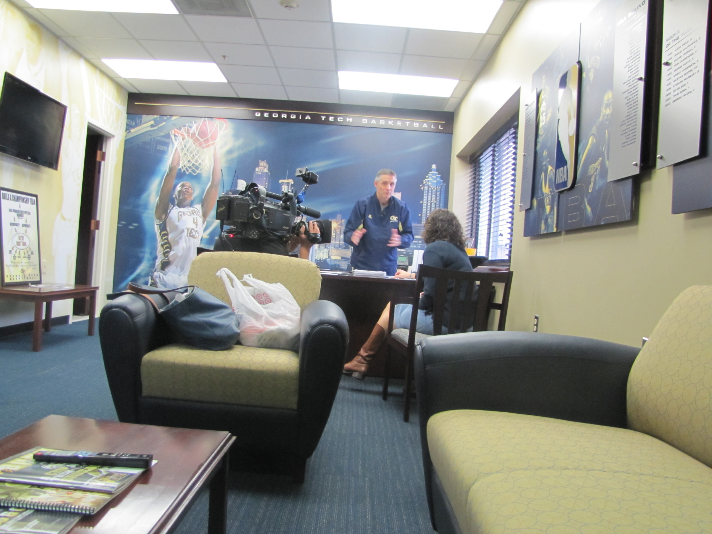 Coach Brian Gregory goes over the team's schedule for exam week with academic advisor Mary Brunk.