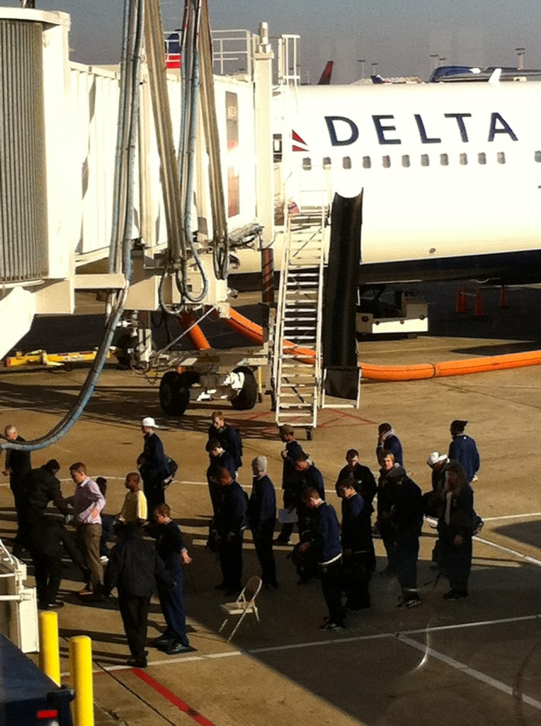 The team get's ready to board the plane